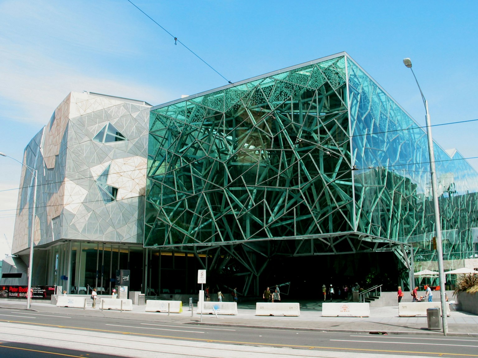 Unique architectural design of Federation Square in Melbourne featuring glass and angular shapes
