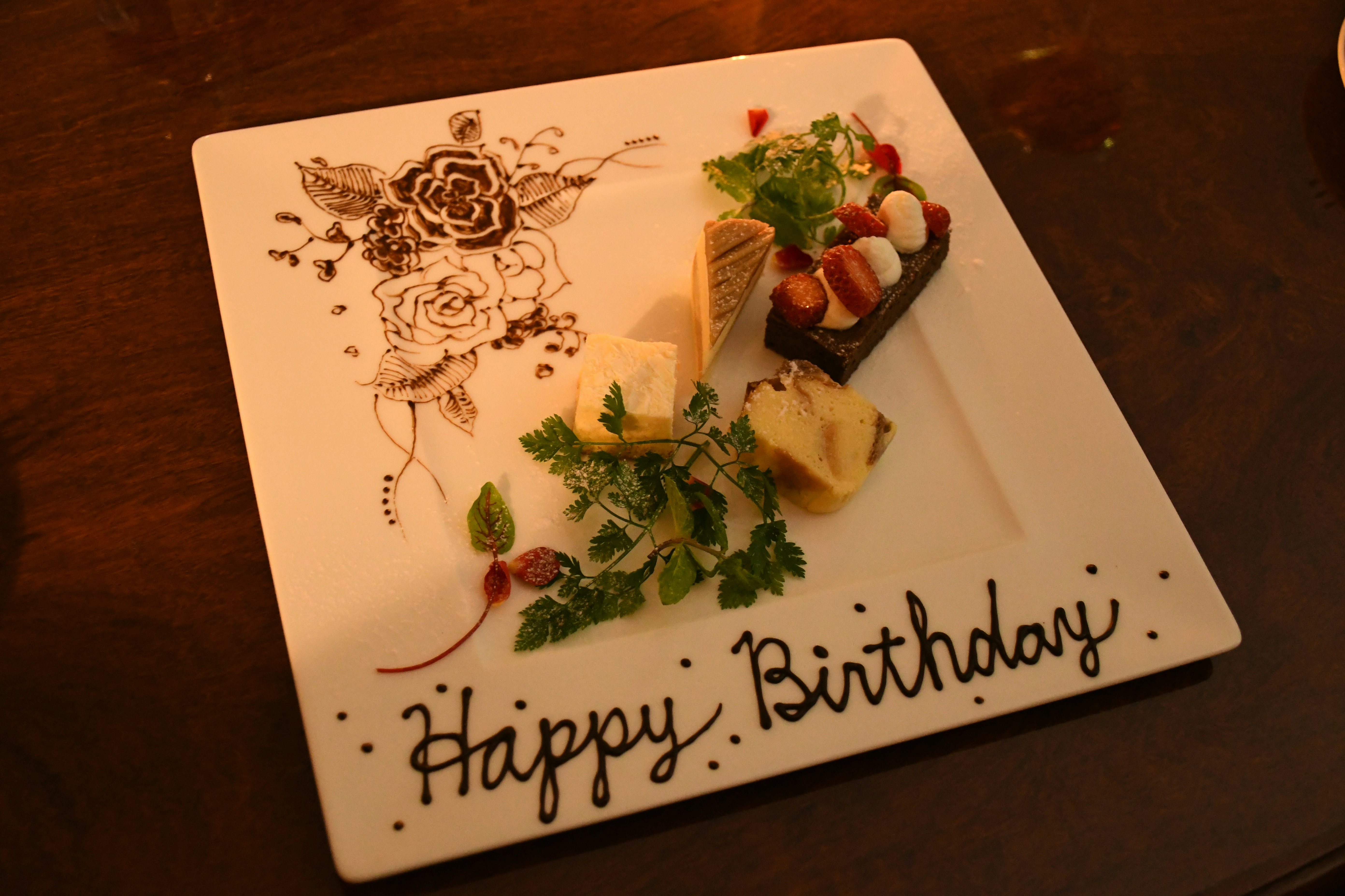 birthday card on a wooden table with cake decorations