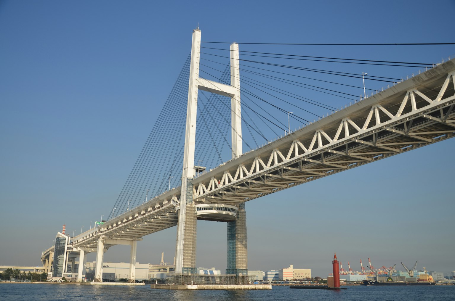 Yokohama Bay Bridge with its impressive structure against a clear blue sky