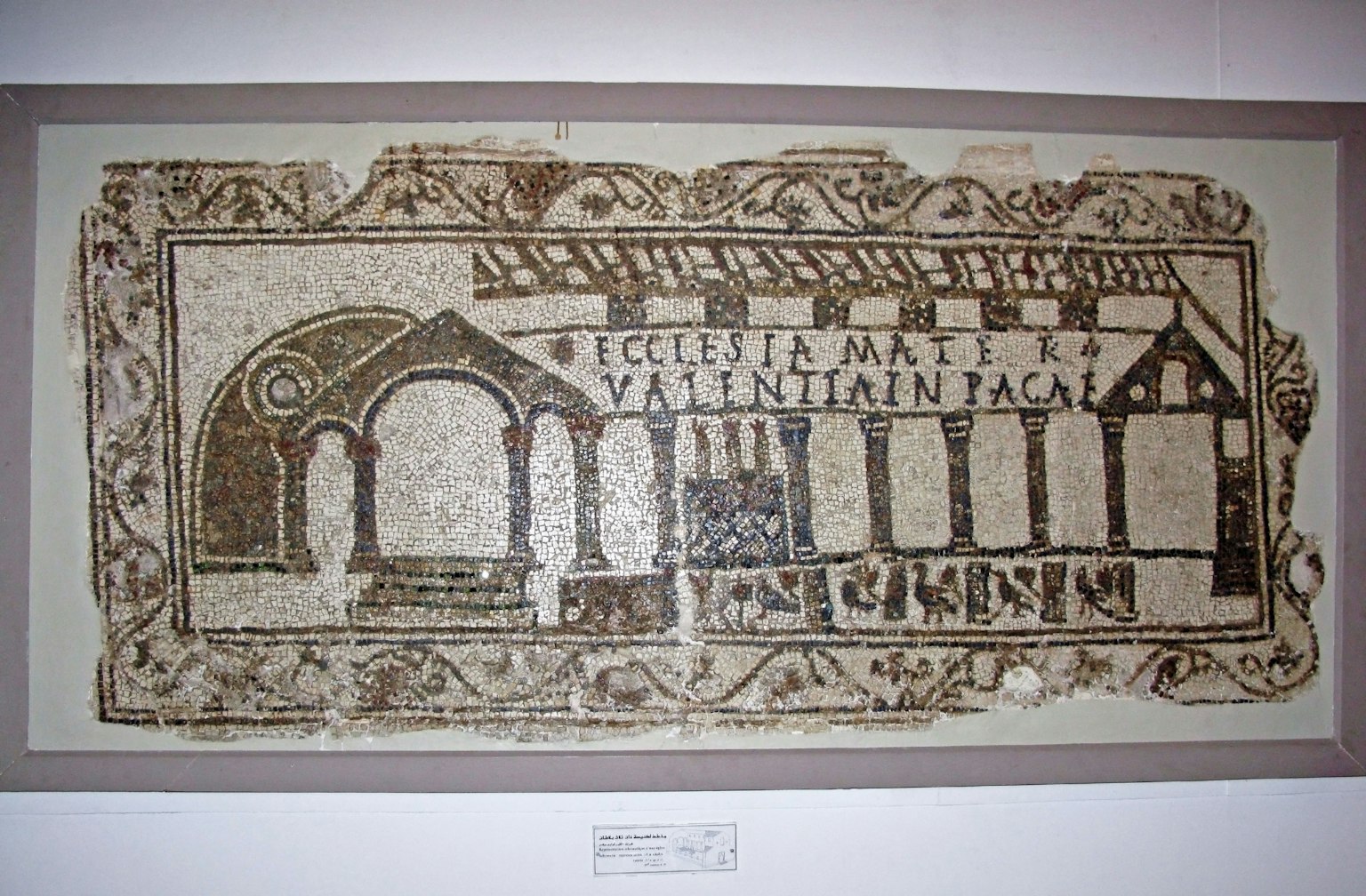 Ancient mosaic artwork depicting architectural elements and arches