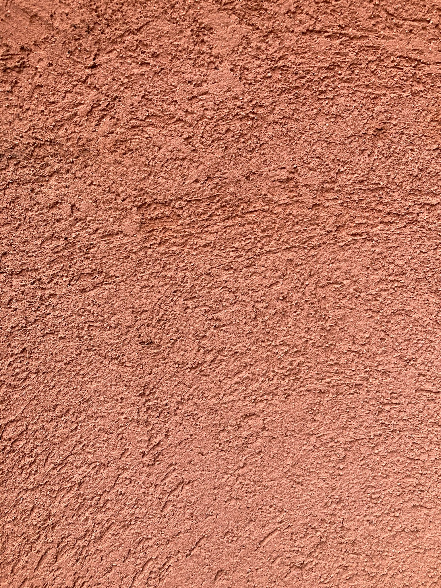 Close-up dinding berwarna pink yang tekstur