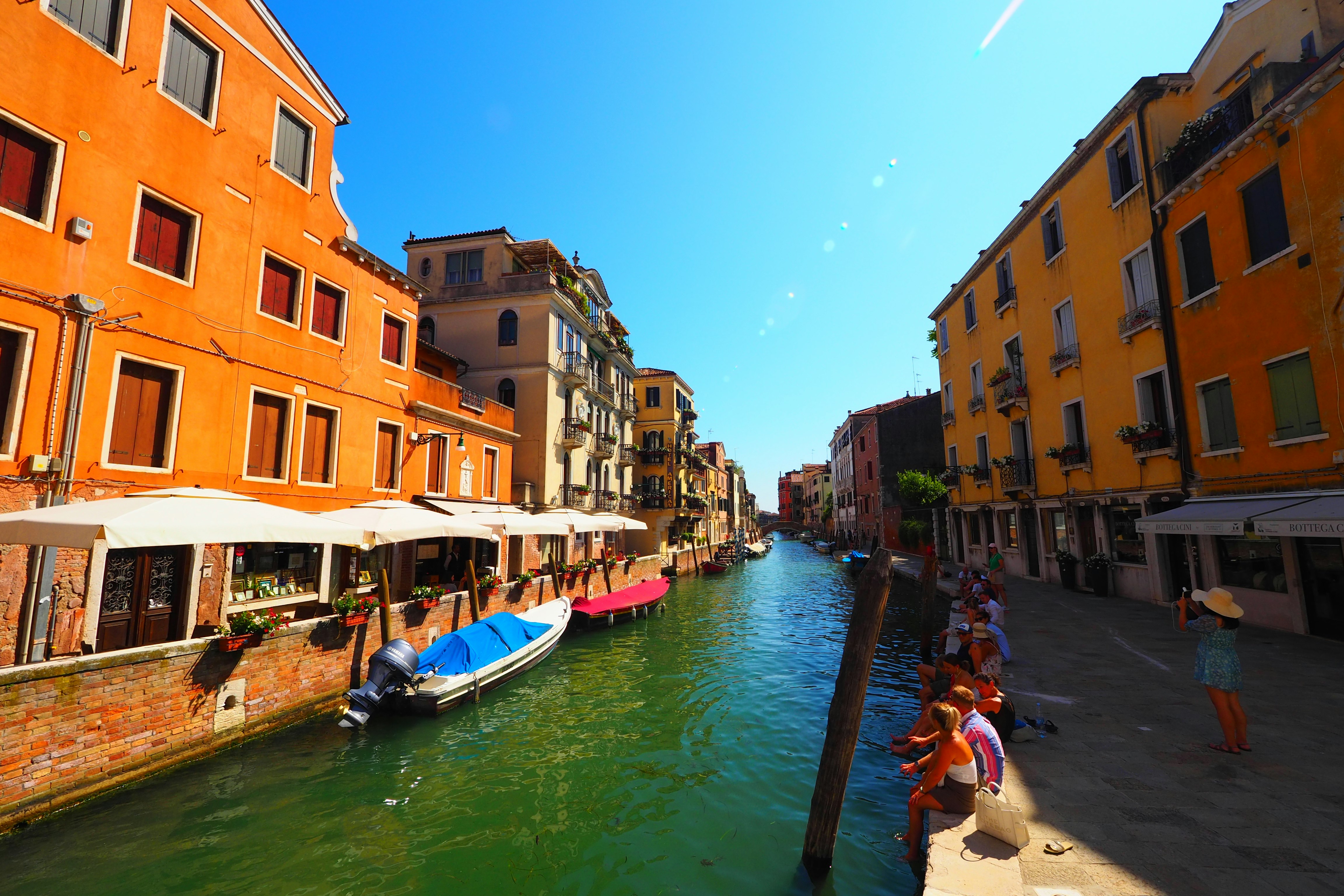 colorful buildings and gondolas along a canal
