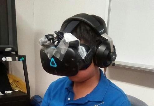 person wearing a VR headset with a head-mounted view