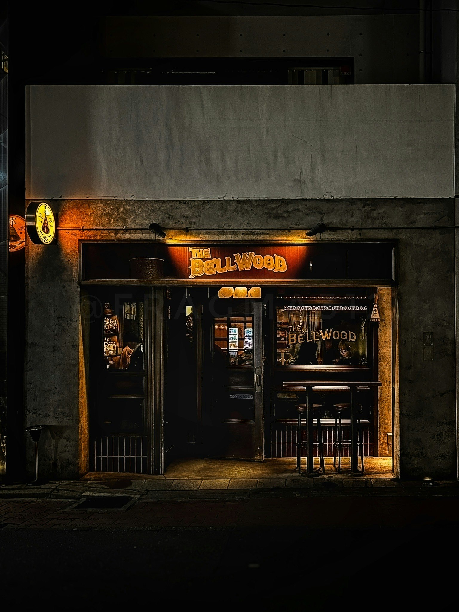 neon-lit storefront in a nighttime alley