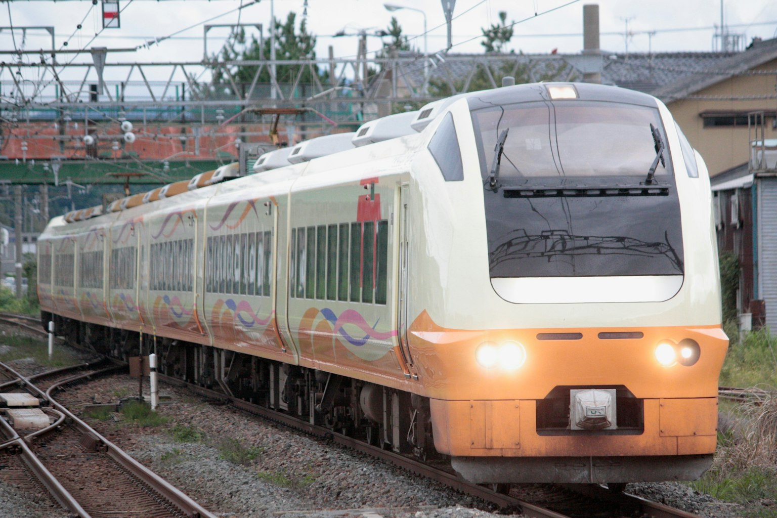 A uniquely designed train moving along the tracks