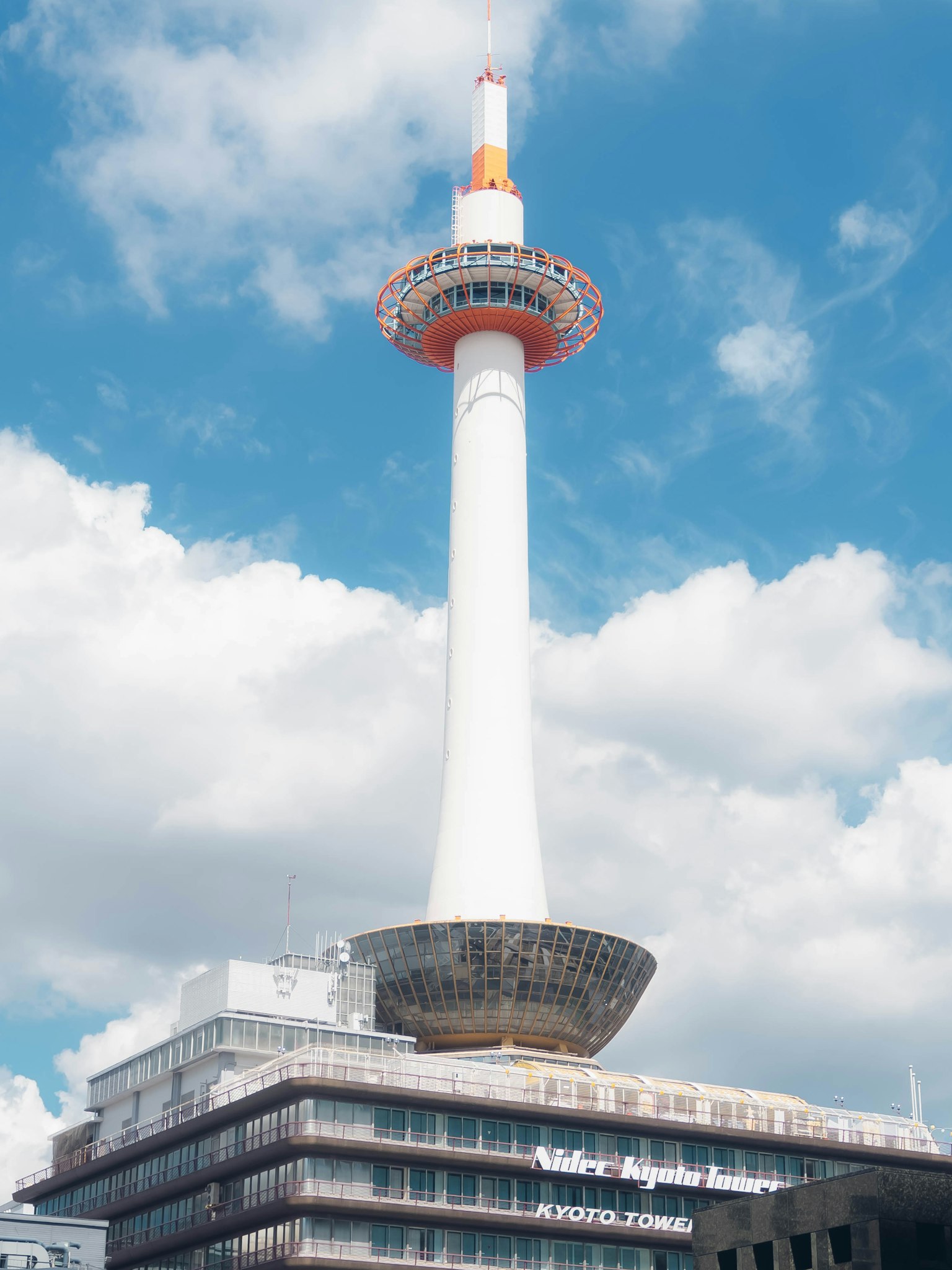 Kyoto Tower with a blue sky backdrop