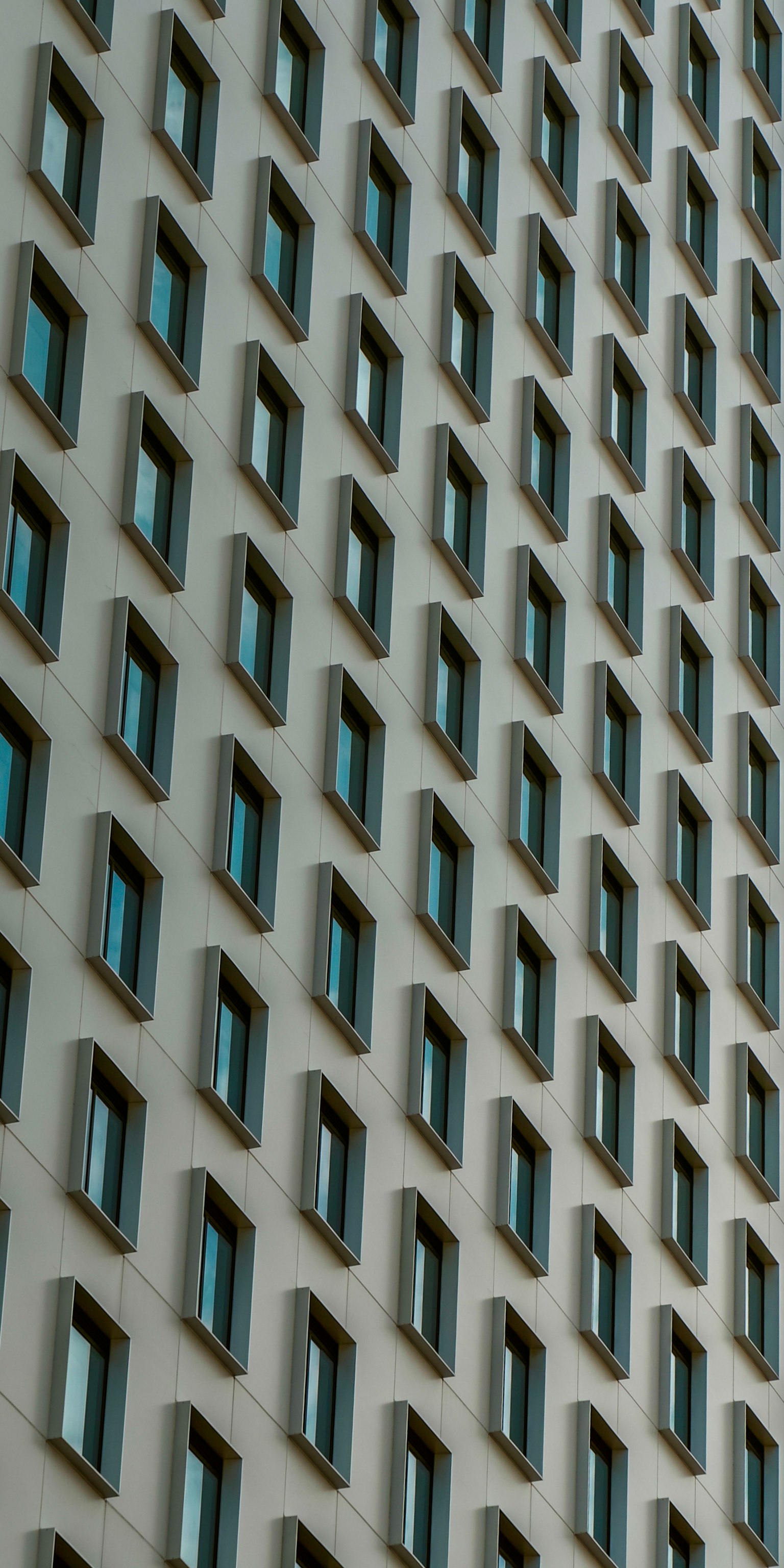 Image featuring a pattern of windows on a building facade