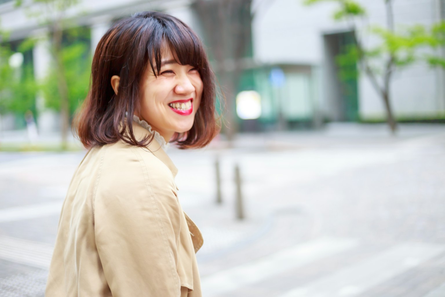 Smiling woman walking in the city