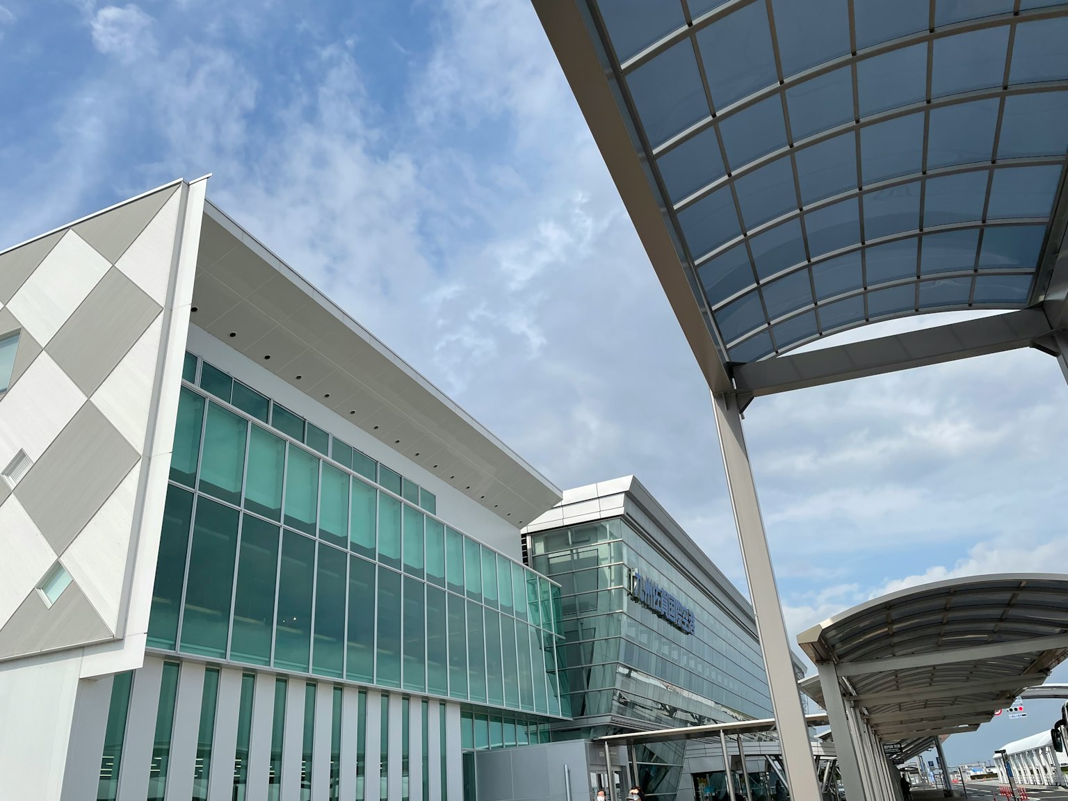 Modern building exterior featuring glass and metal structure