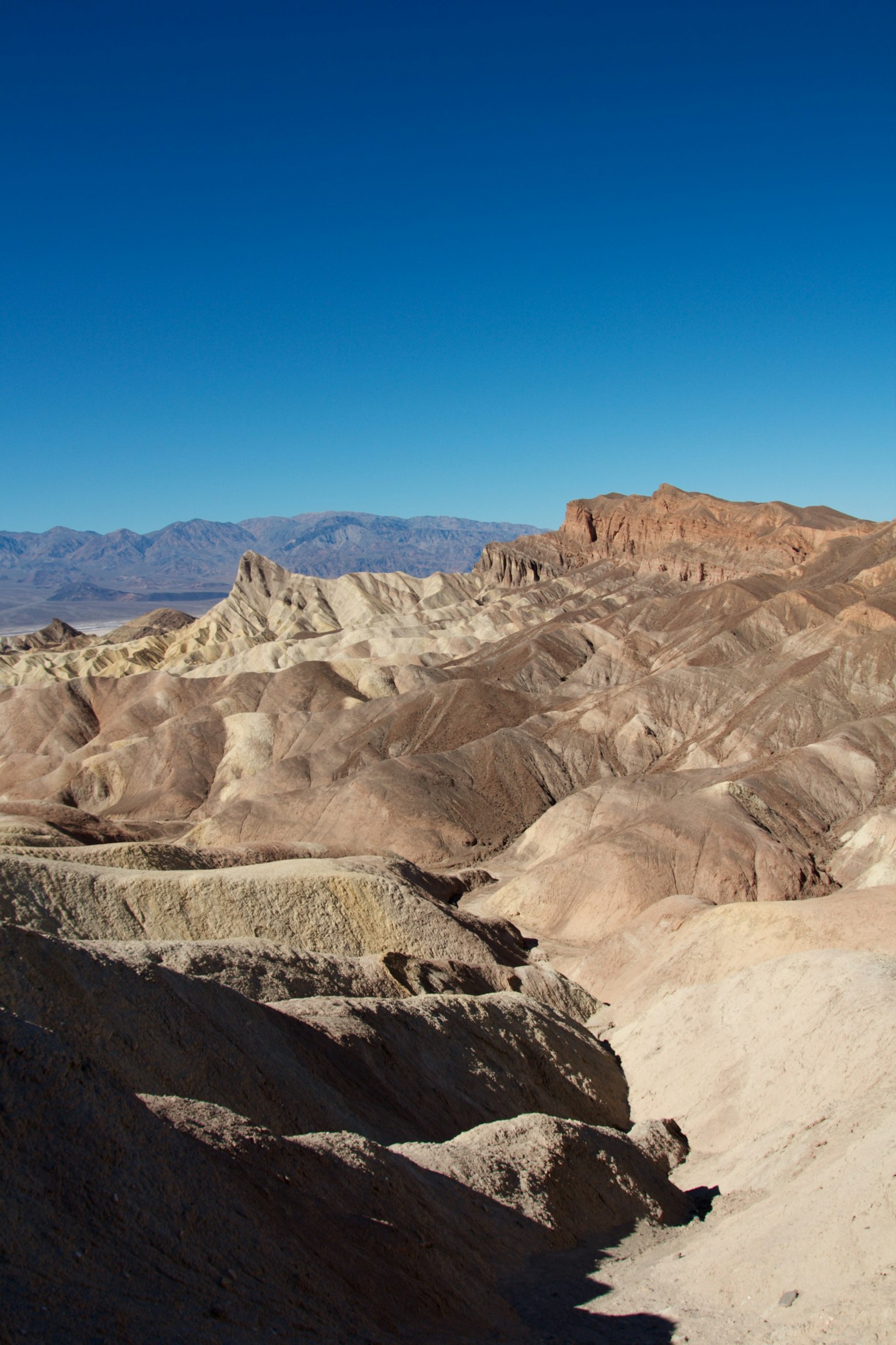 Landscape of colorful hills under a clear blue sky