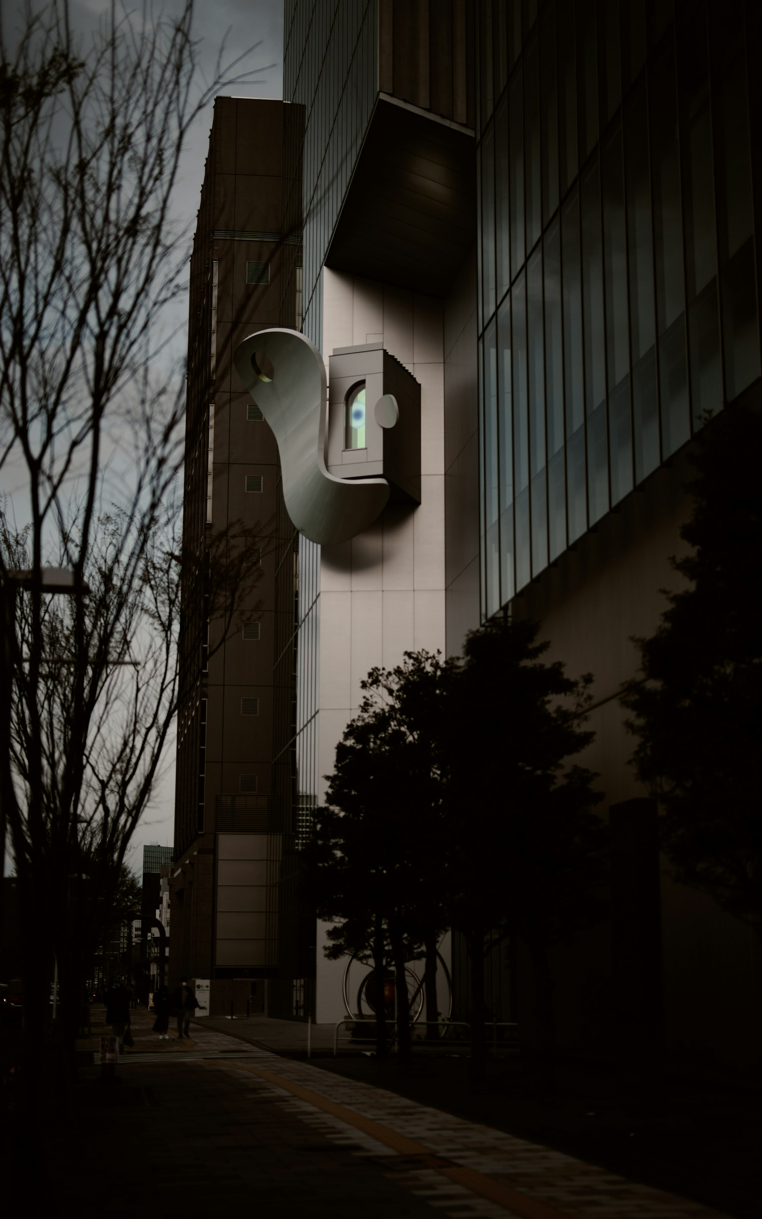 Unique building exterior with a striking design set against a dark background