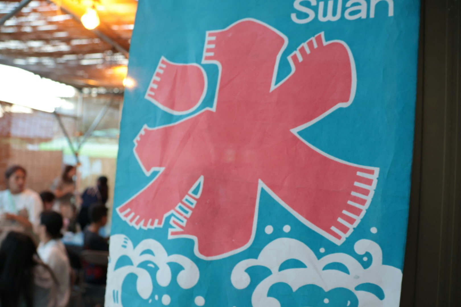 summer shaved-ice syrup banner with people inside a shop
