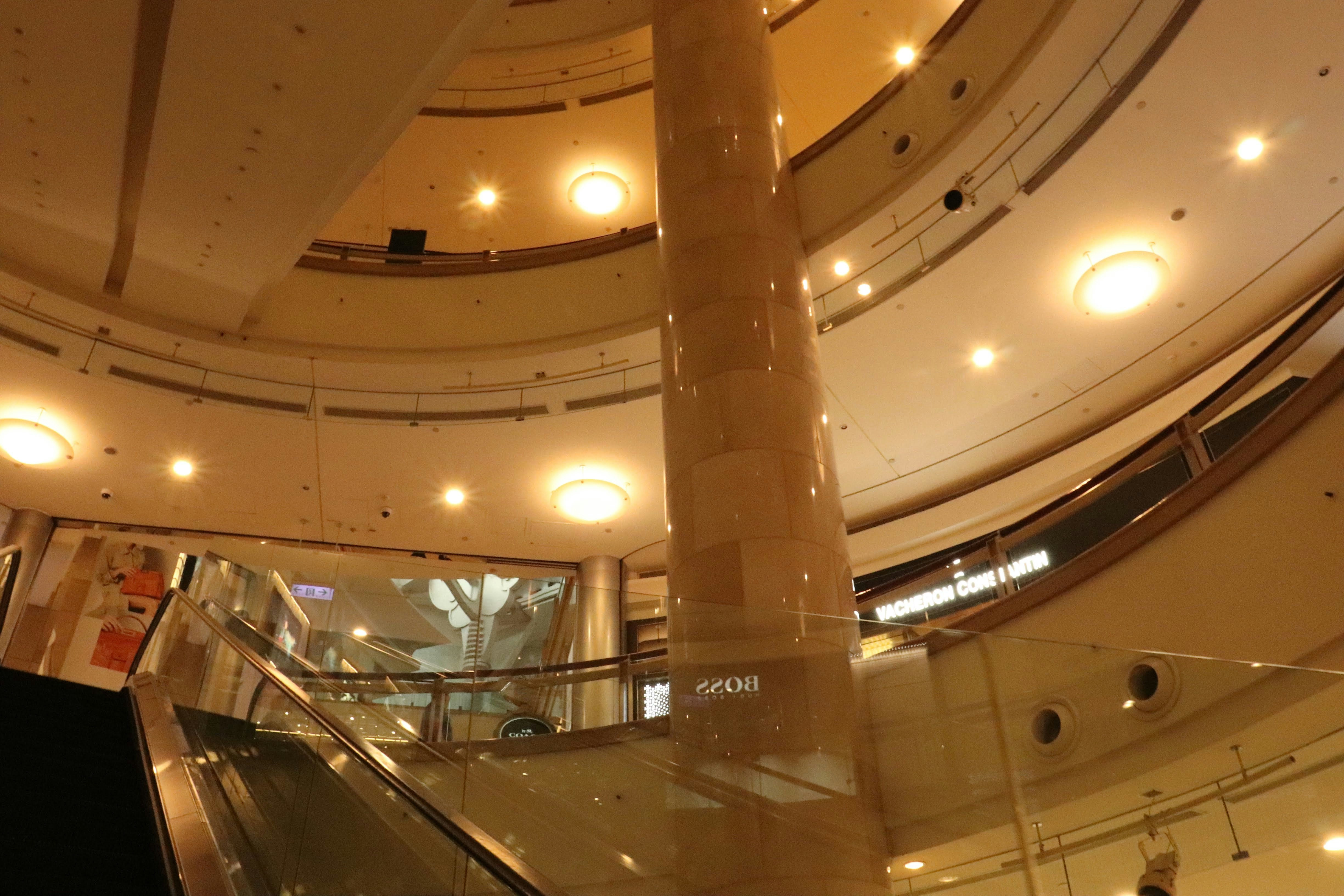 interior of a large shopping mall with a high atrium