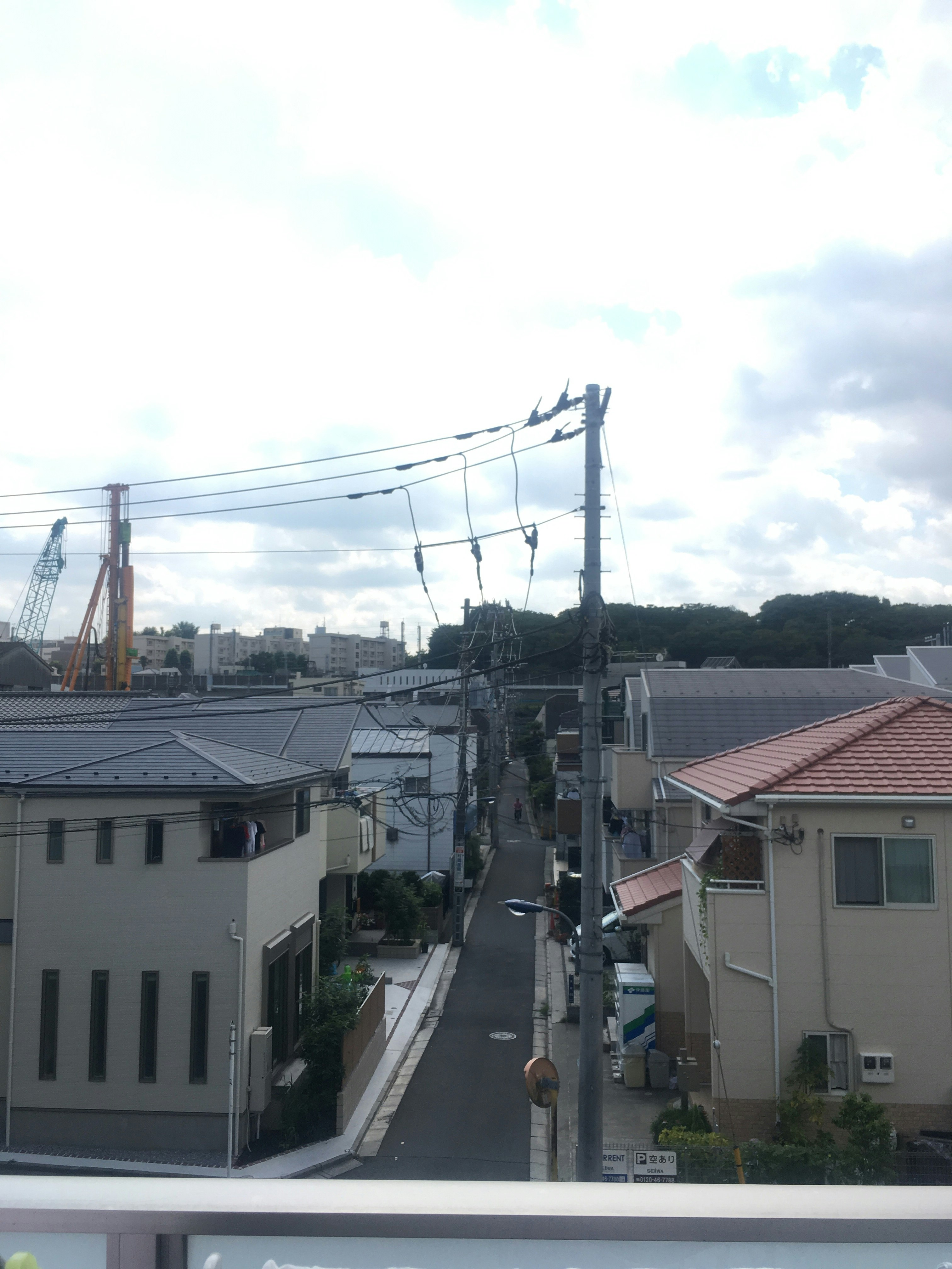 Residential alley street scene with overhead power lines
