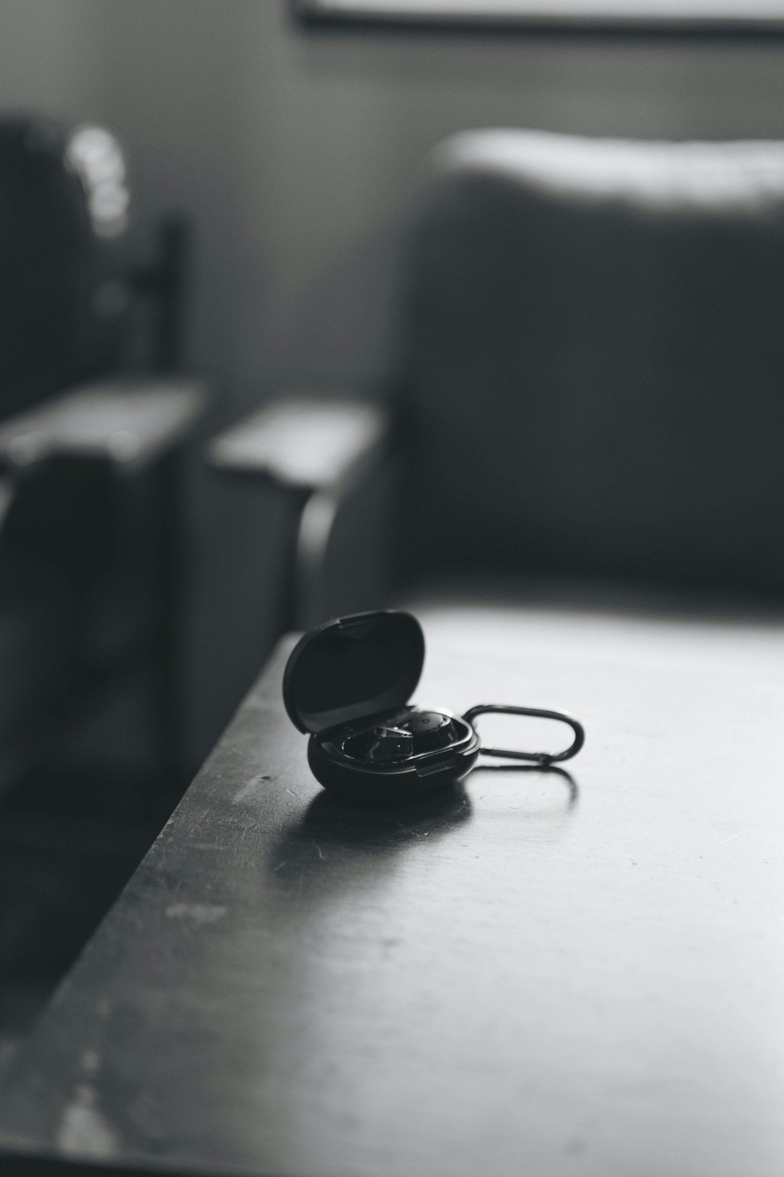 Image of a black case and earphones placed on a table