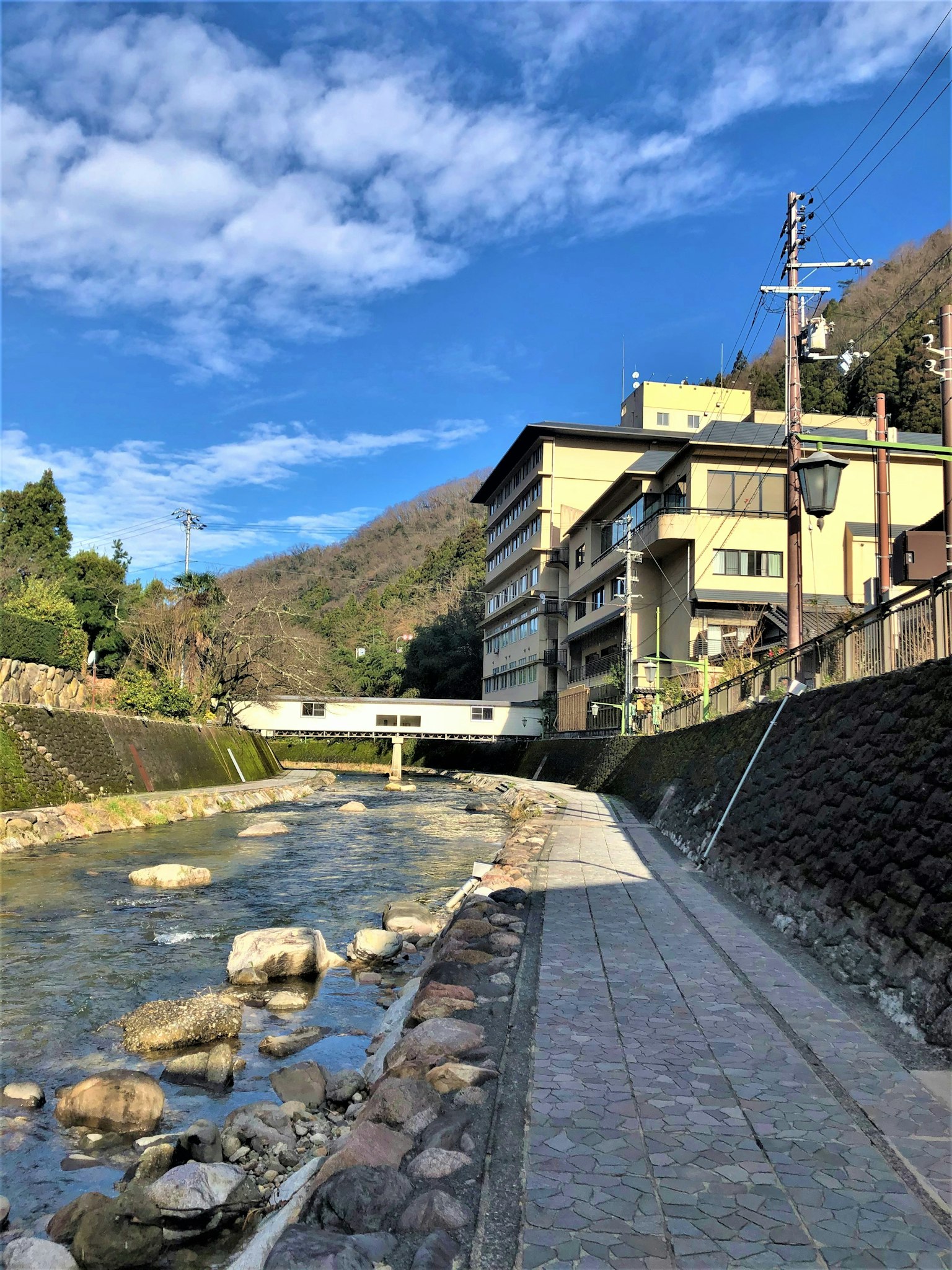 Scenic view of a river with buildings and a blue sky