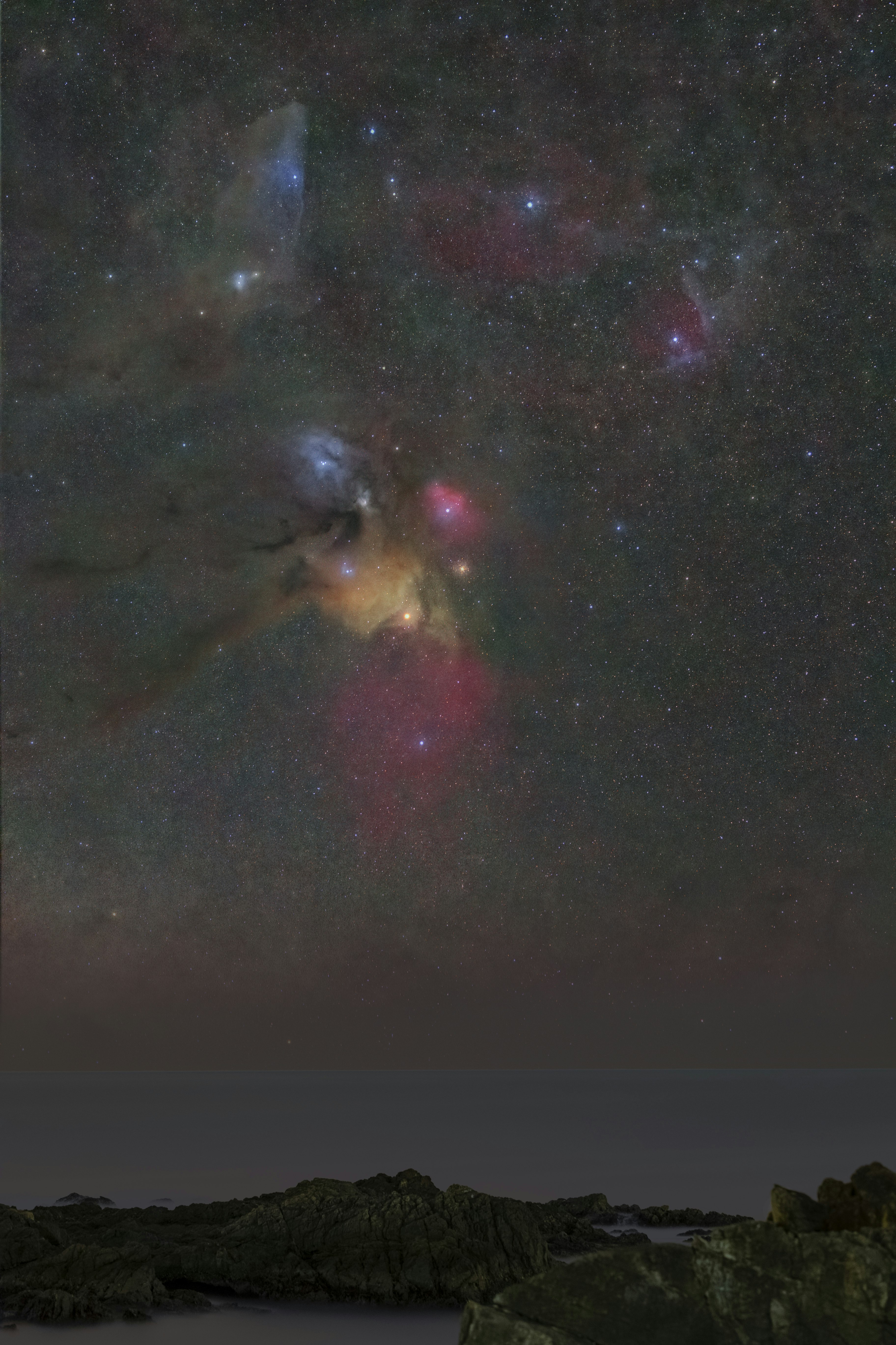 Vibrant nebulae and star clusters in a starry sky
