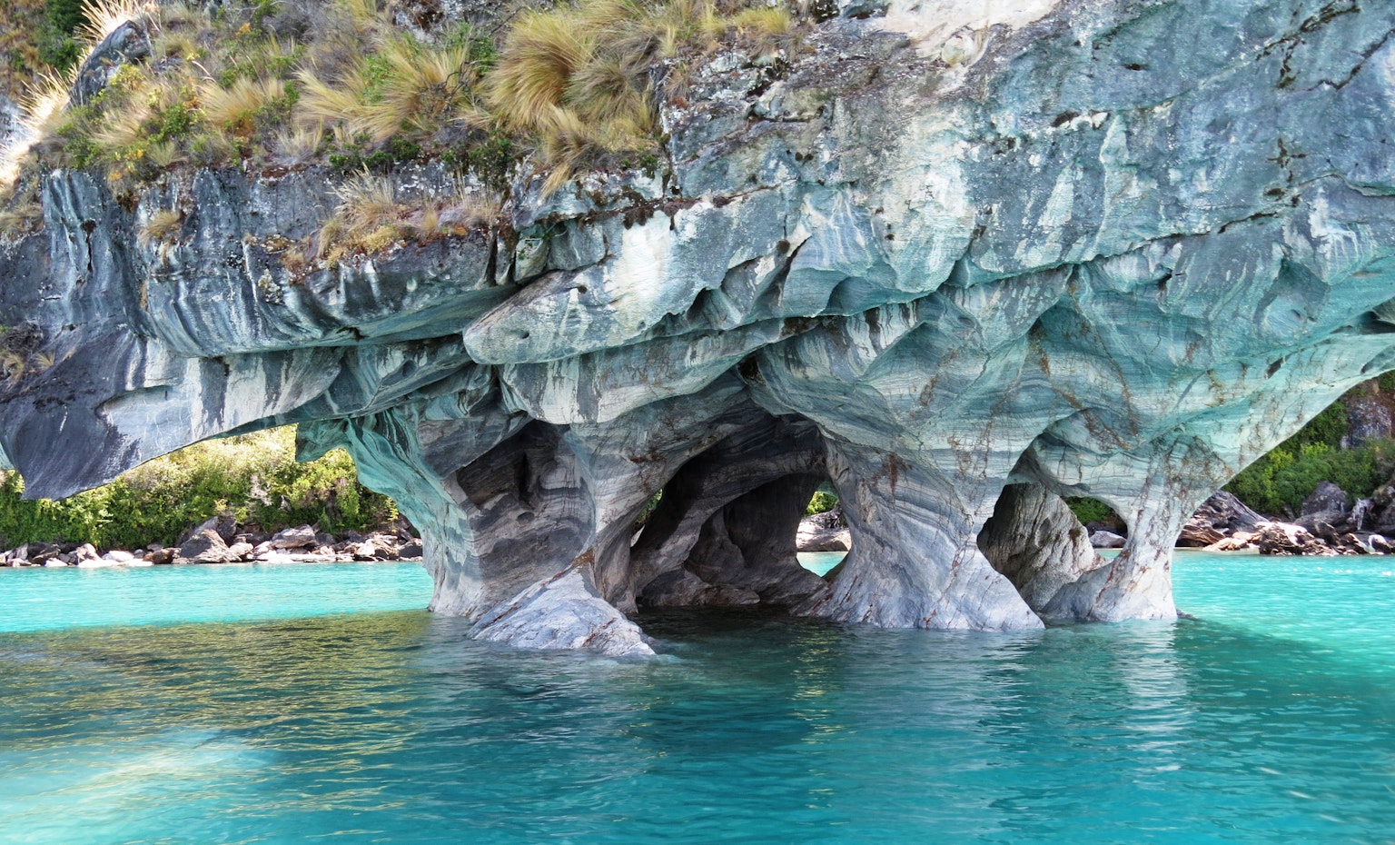 Unique rock formation in clear turquoise water