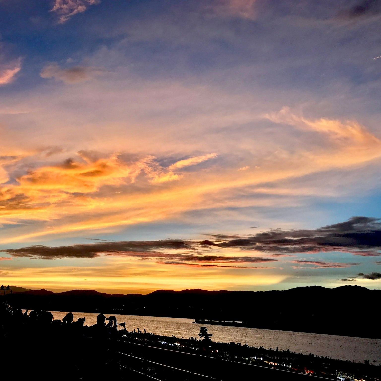Beautiful sunset over a river with mountains in the background