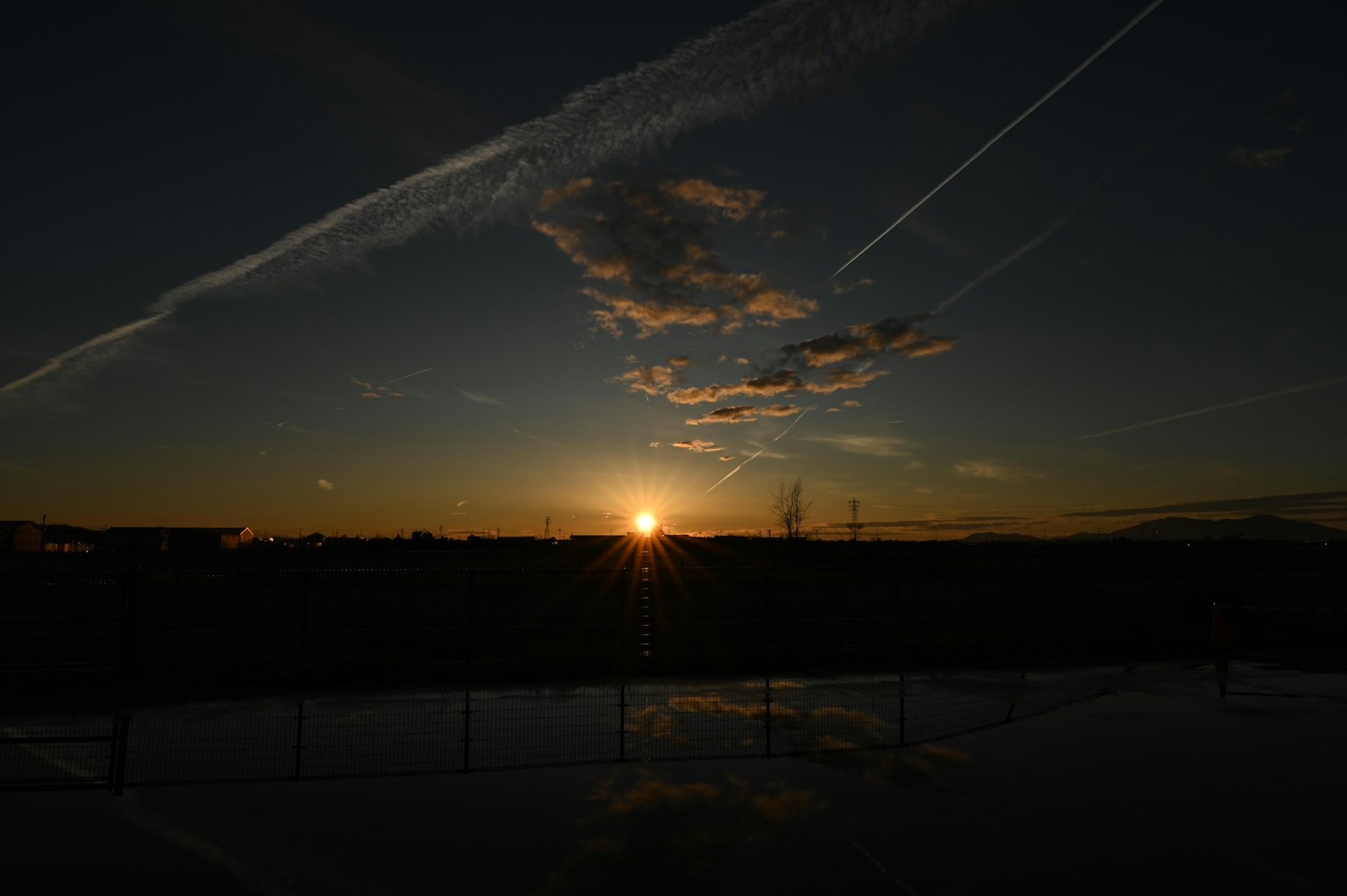 Beautiful landscape with sunset and cloud silhouettes
