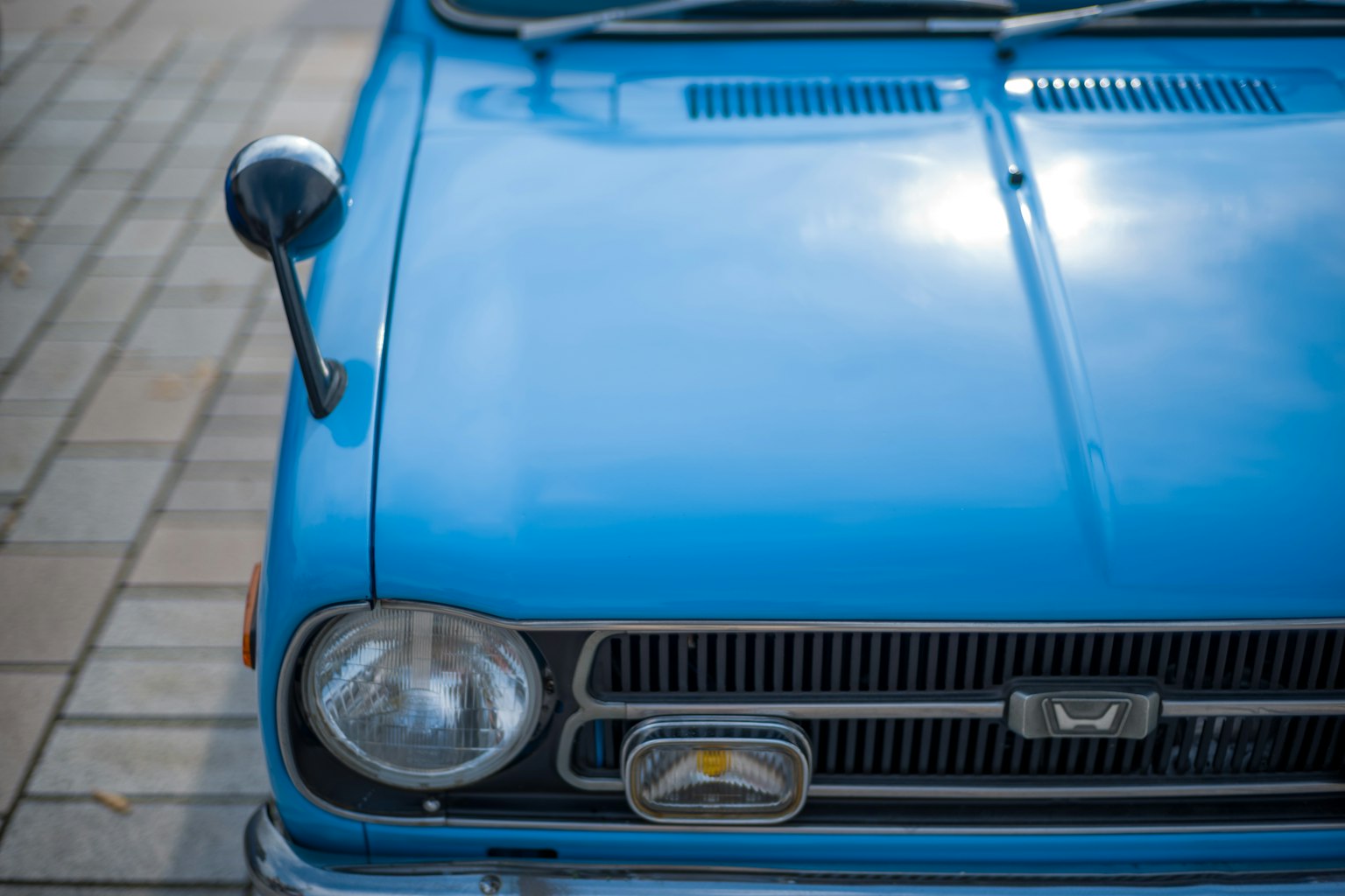 Close-up of a classic blue car front