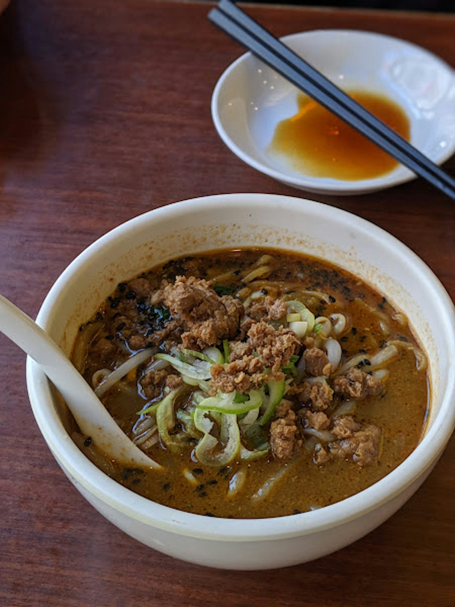 Rich soup ramen topped with meat and green onions