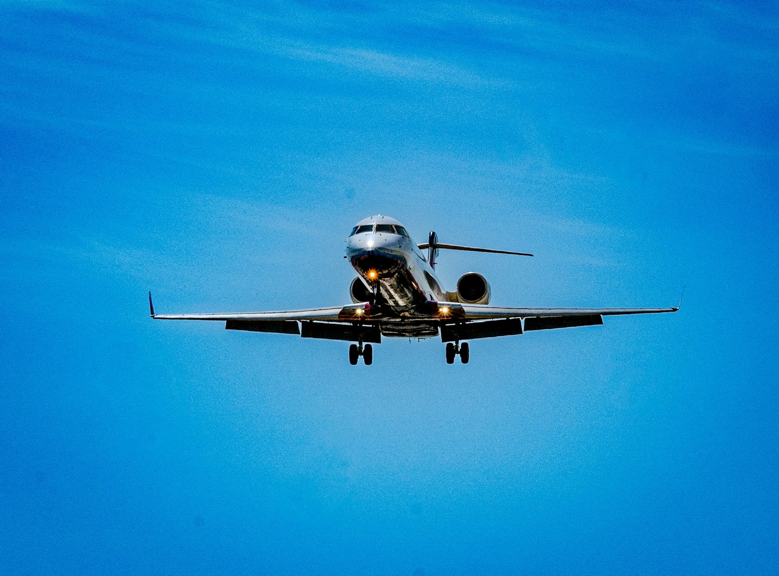 Passenger airplane flying against a blue sky