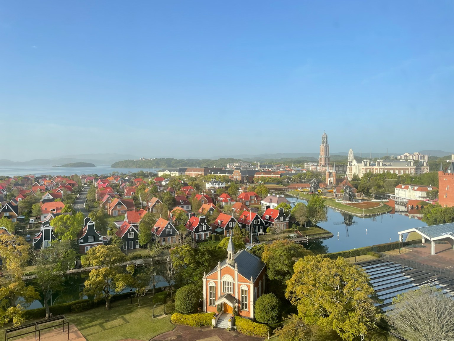 A scenic view of a Dutch town with canals and colorful houses
