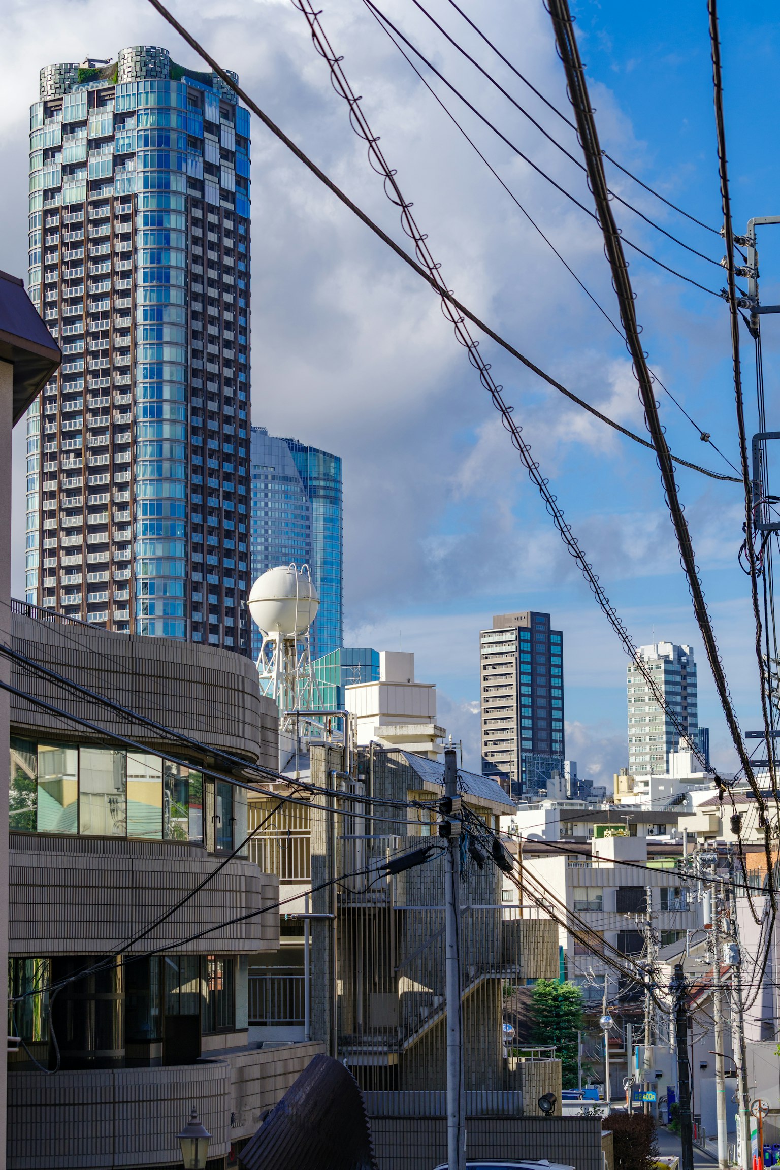 Cityscape featuring skyscrapers and power lines