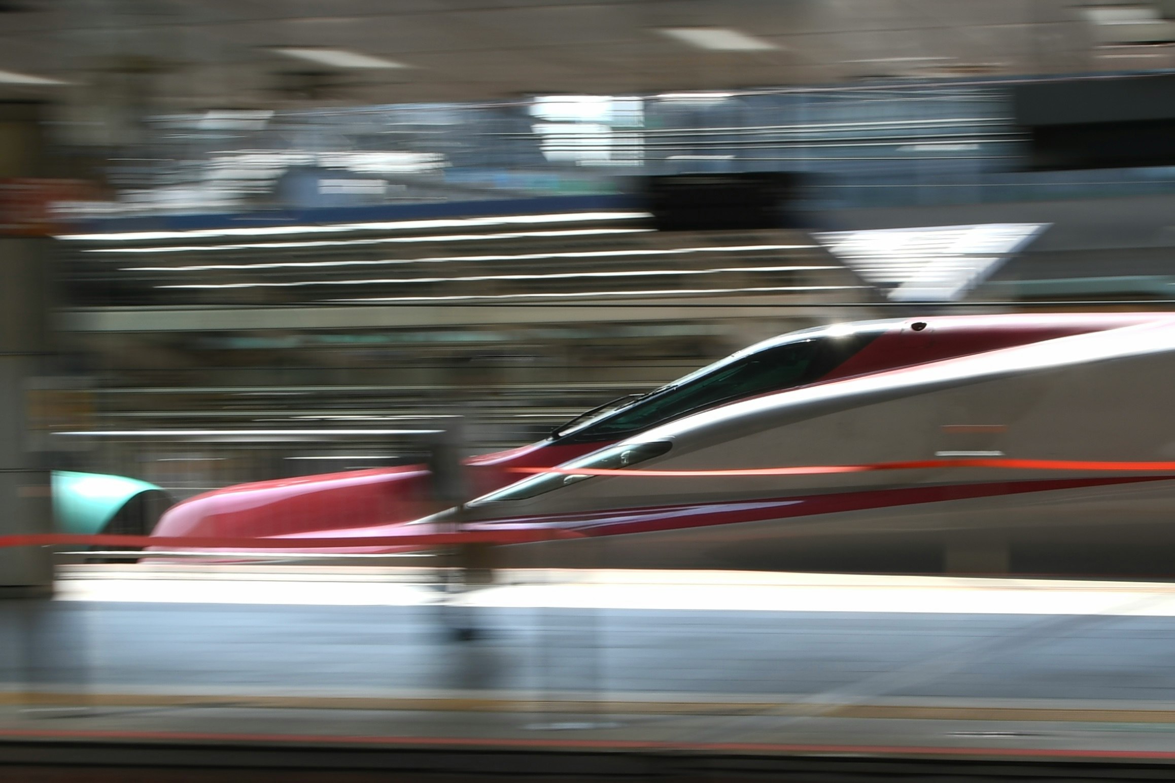 motion-blurred view of a fast train passing by