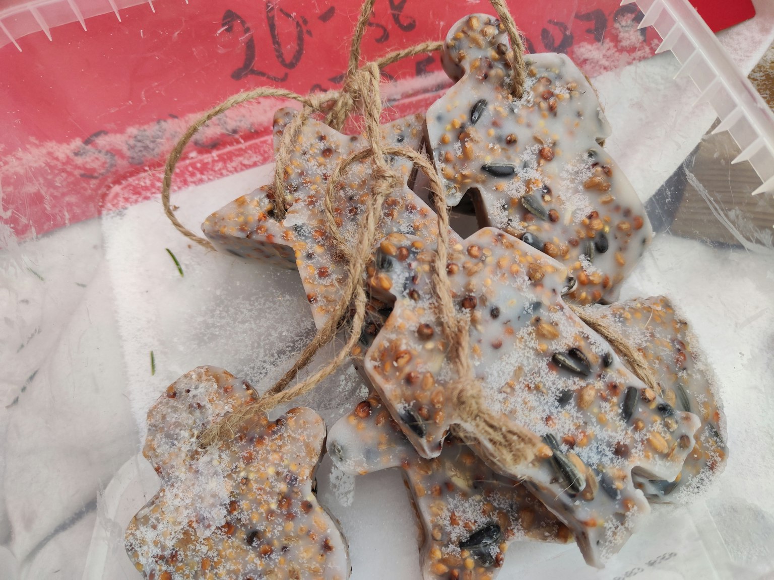 Homemade cookies shaped like trees with white icing on top