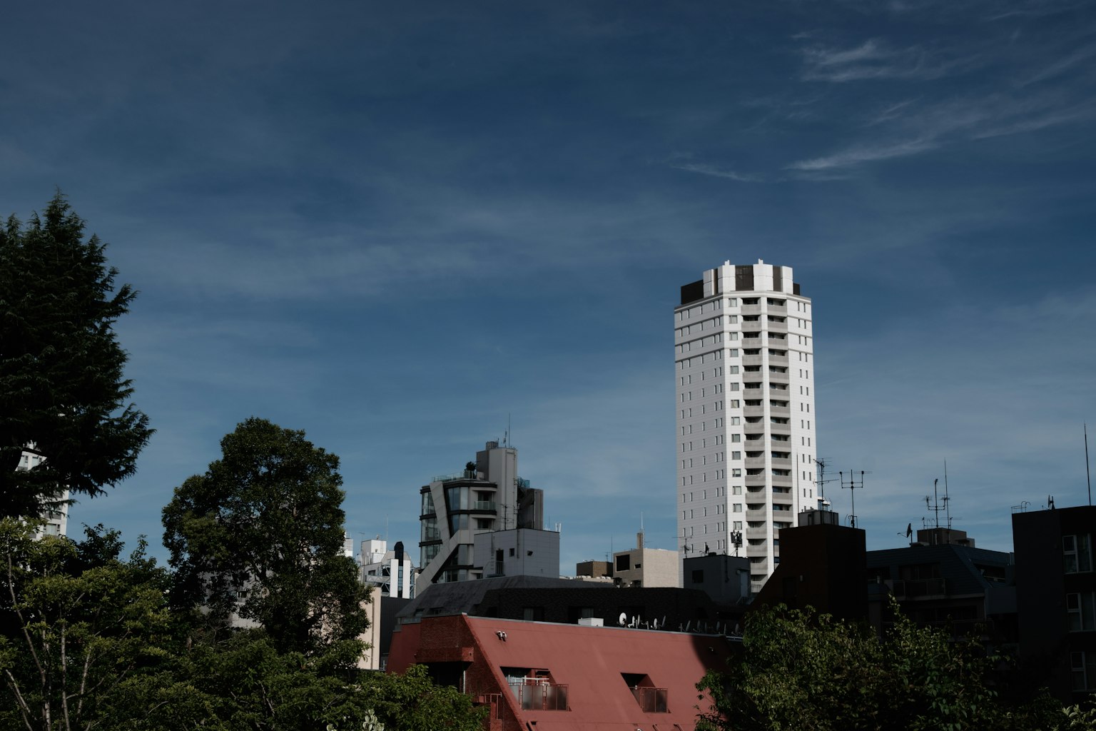 Urban landscape featuring high-rise buildings and lush greenery