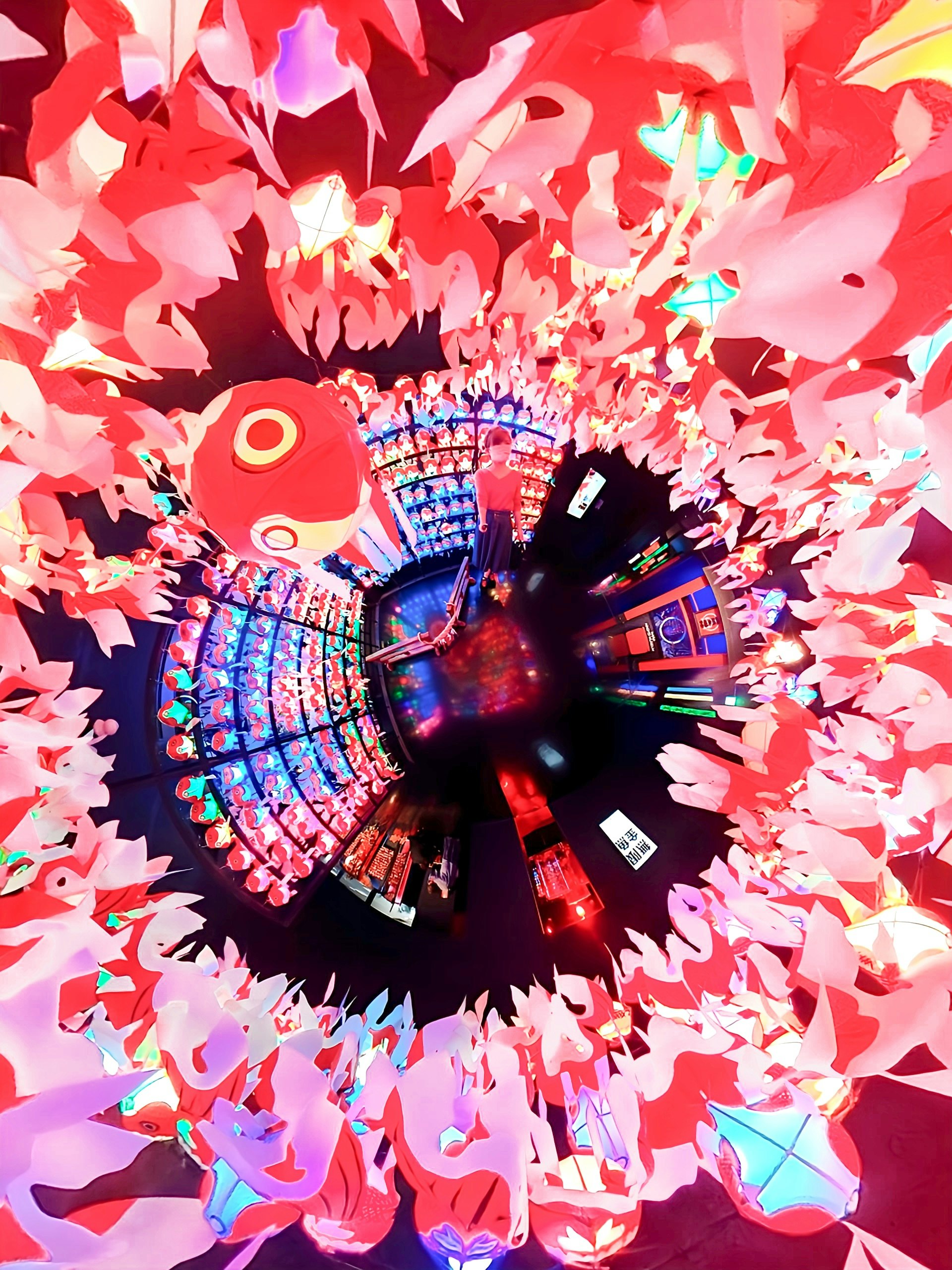colorful tunnel-like passage surrounded by red confetti
