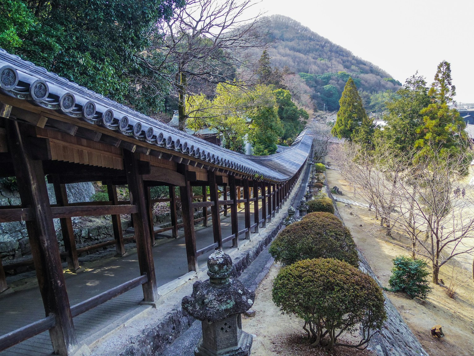 Scenic view of a temple corridor with a mountain in the background