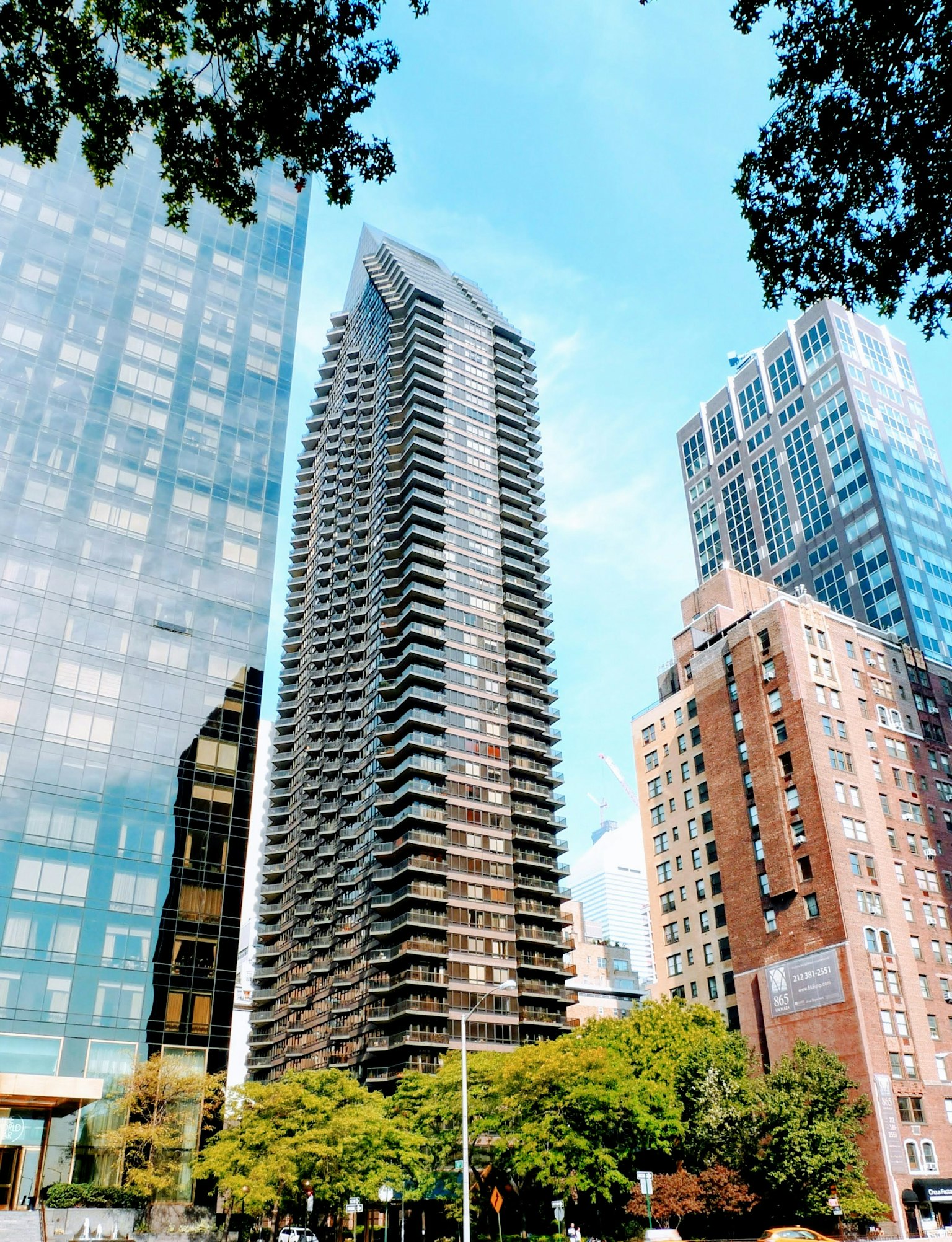 Urban skyline featuring modern skyscrapers and clear blue sky