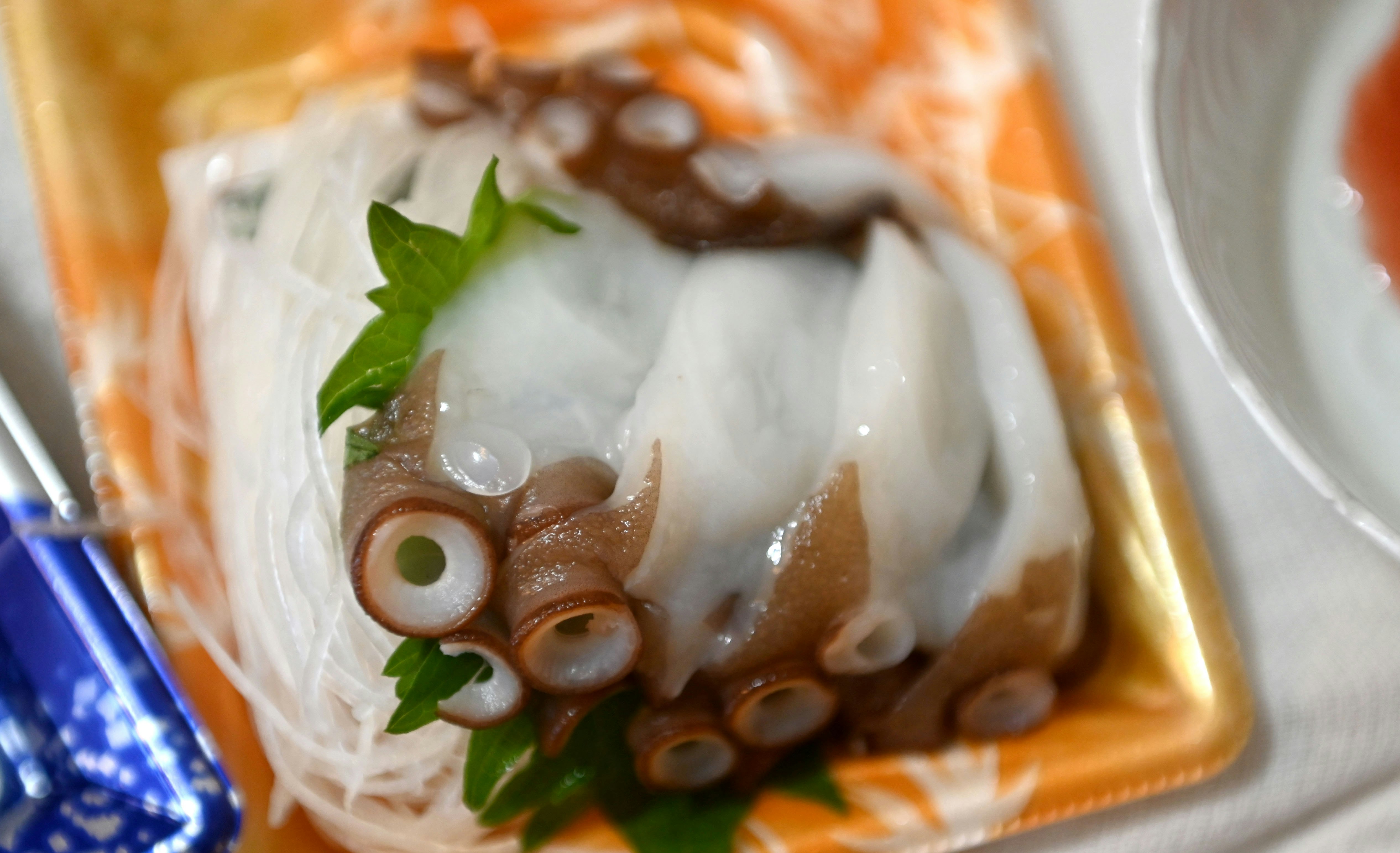 sashimi platter in an orange dish image