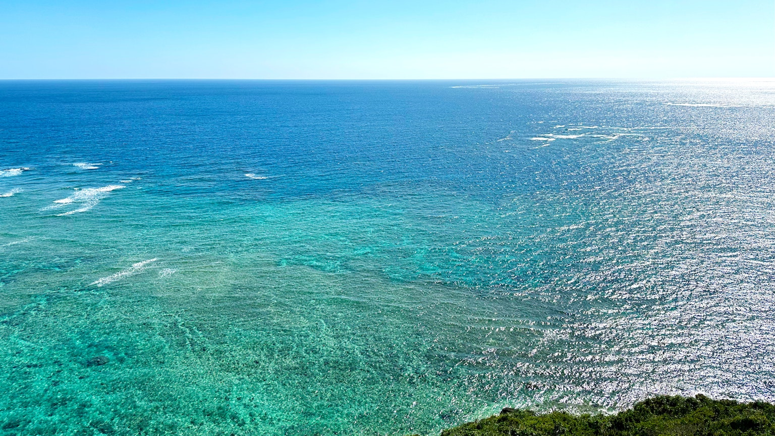 Vast blue ocean with clear turquoise water