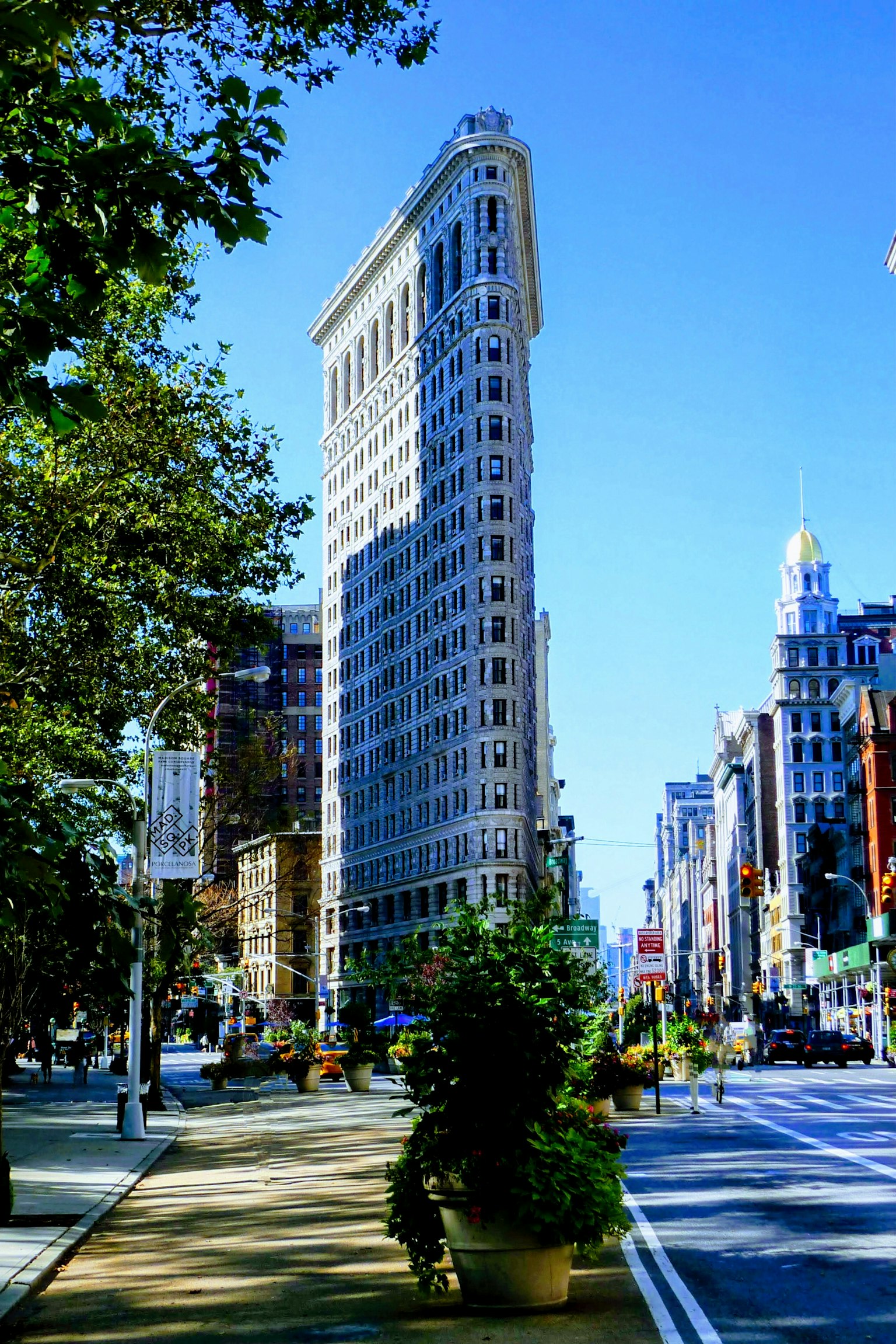 Flatiron Building in New York under a clear blue sky