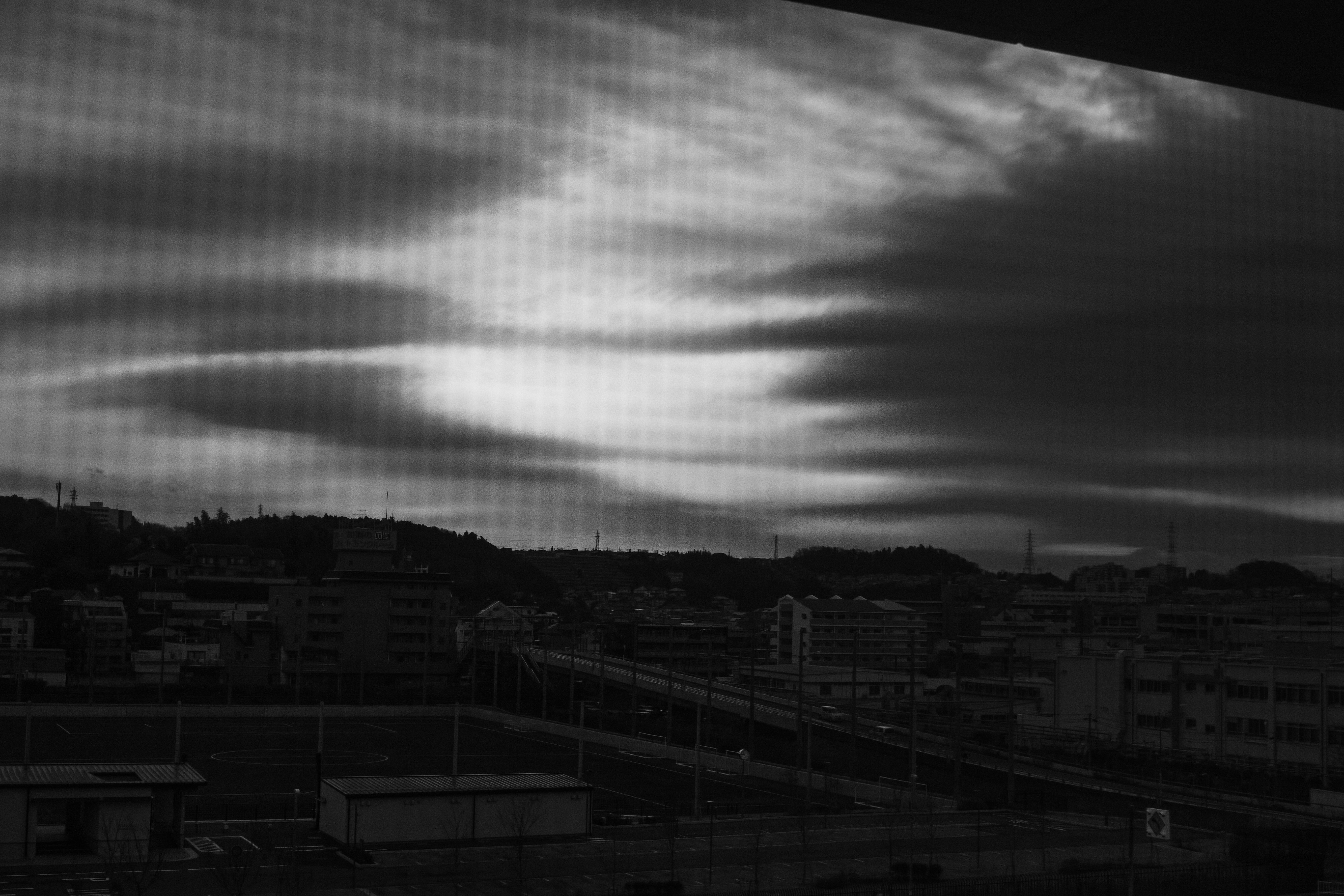 overlooking cityscape under a dusk sky