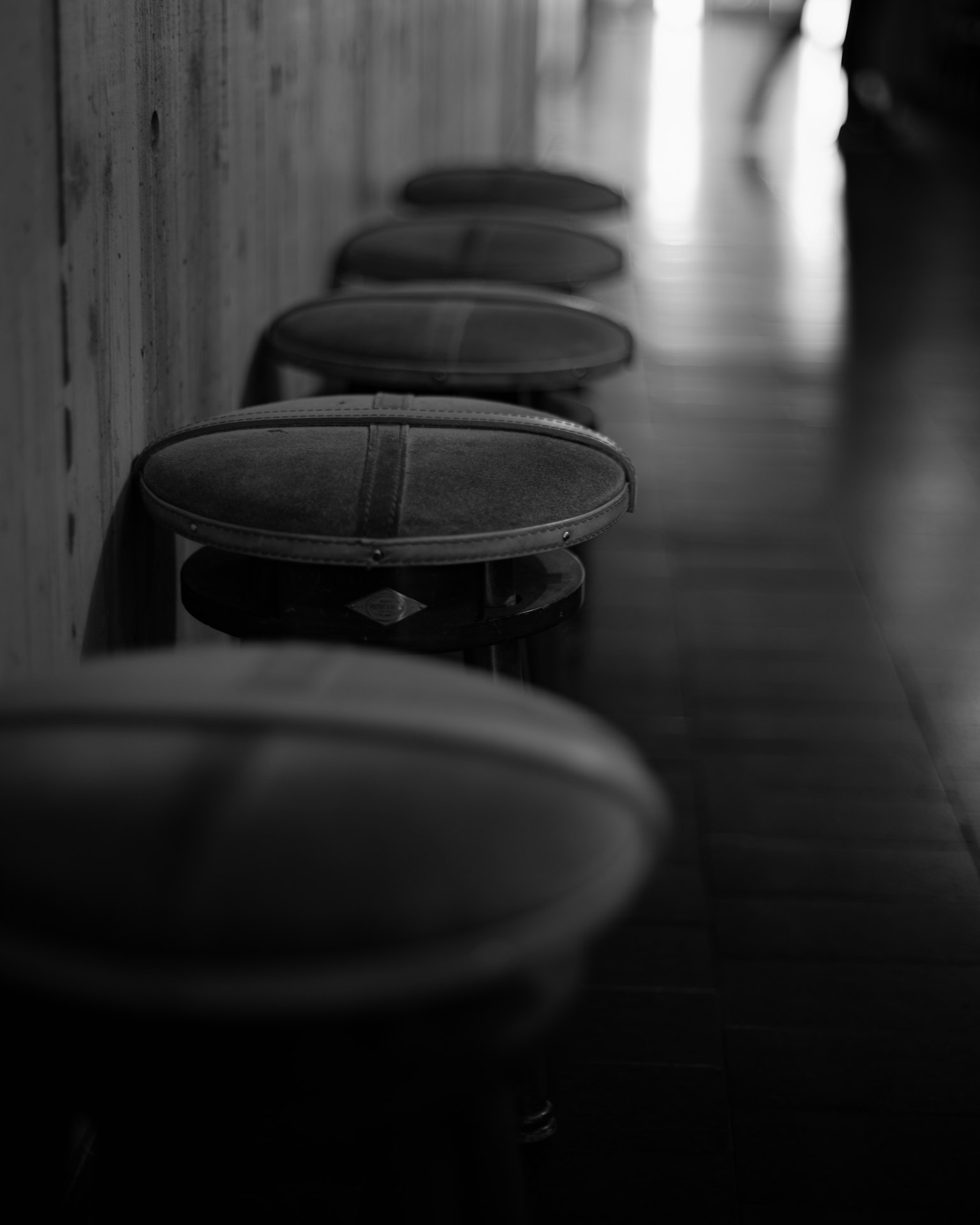 Row of stools in a black and white setting