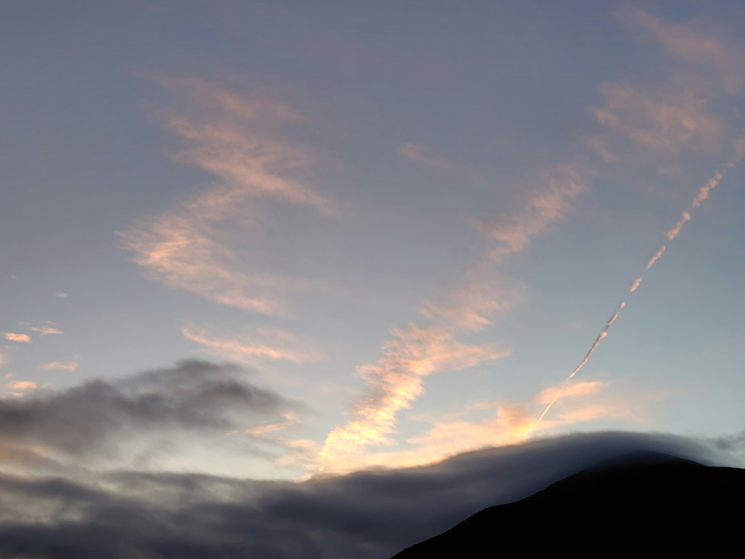 Colorful clouds in a sunset sky with soft hues