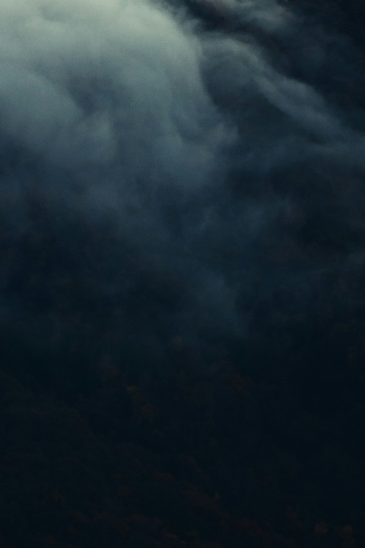 Image featuring textured dark clouds with a moody atmosphere