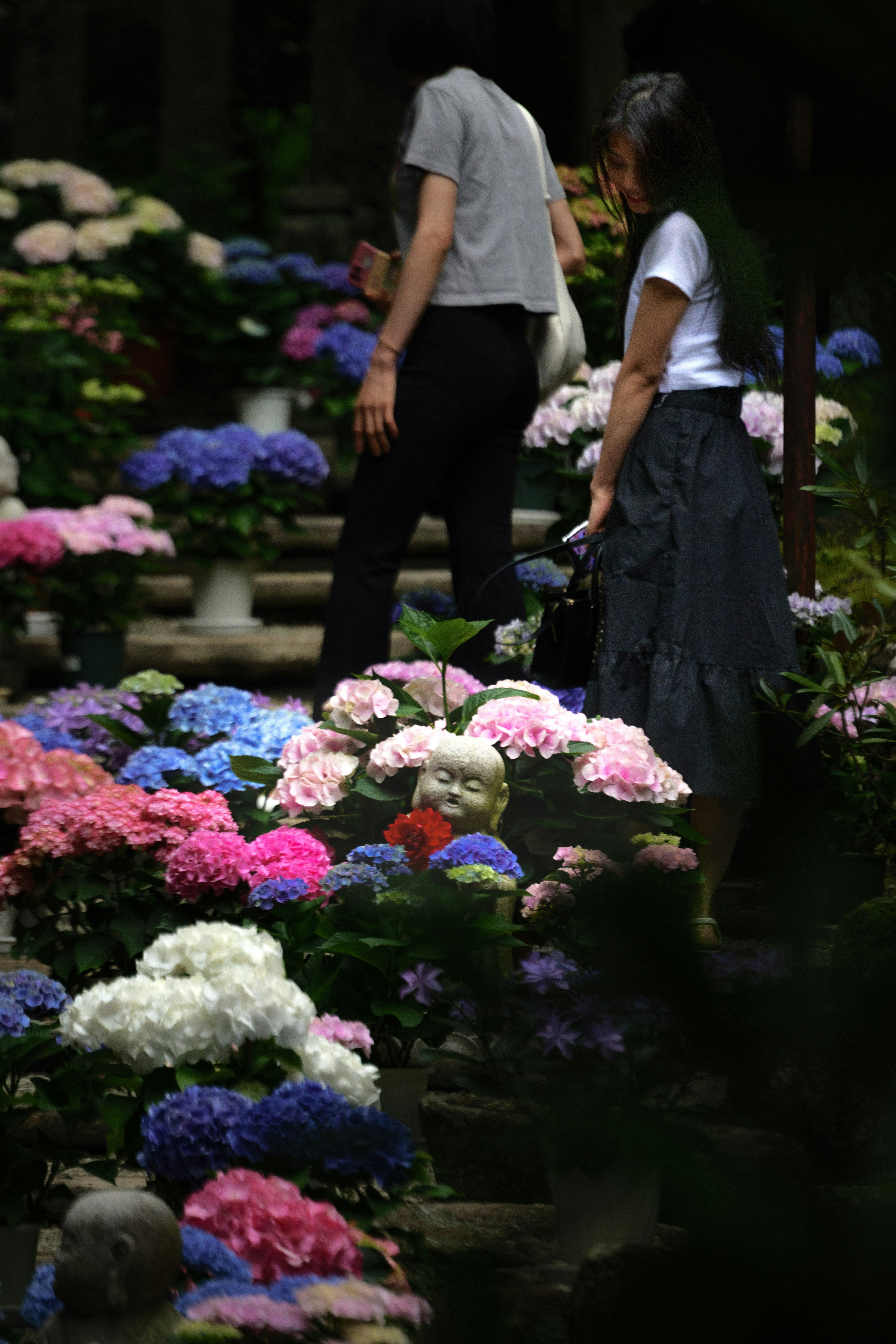 garden scene with people tending flowers at Okadera