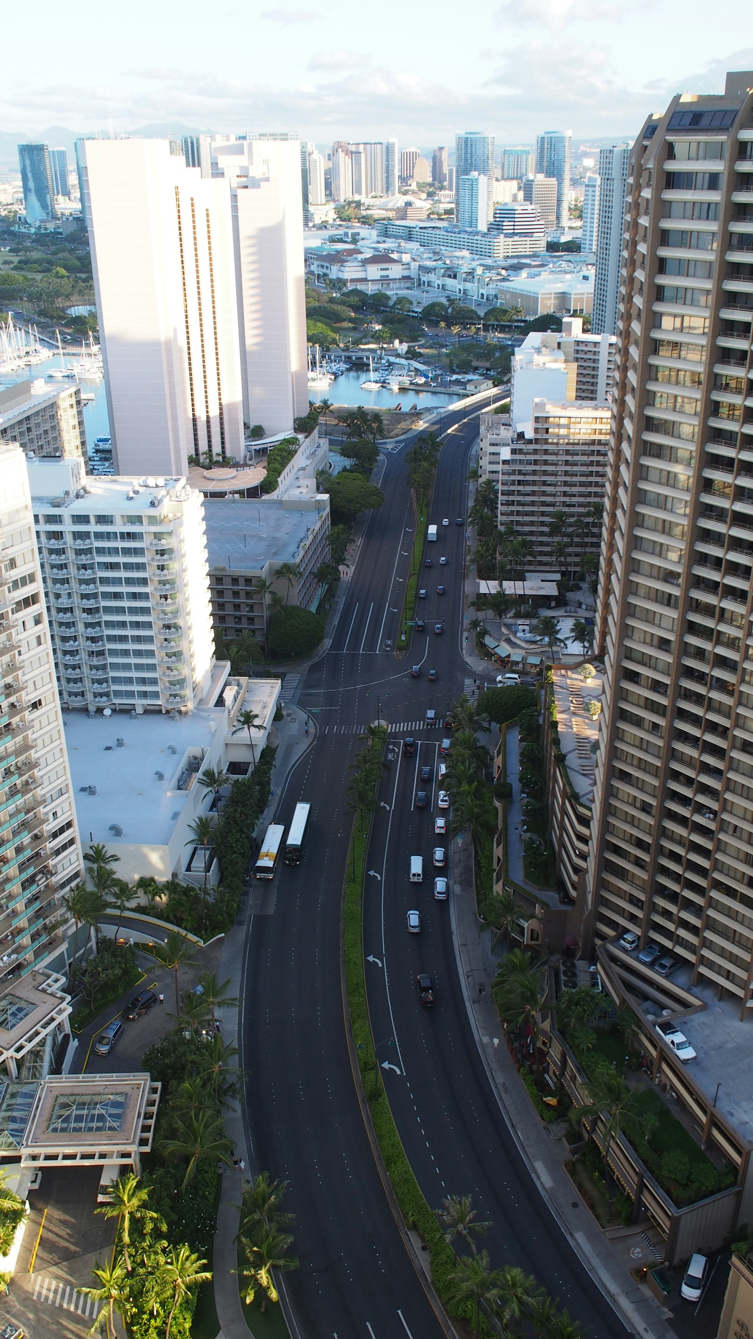 Urban landscape featuring high-rise buildings and a winding road