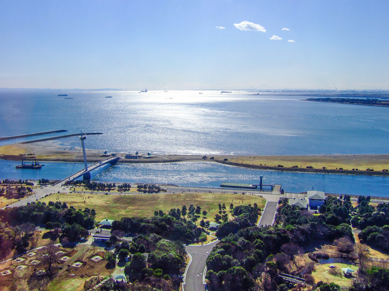 Beautiful landscape of sea and park bright blue sky and shimmering water