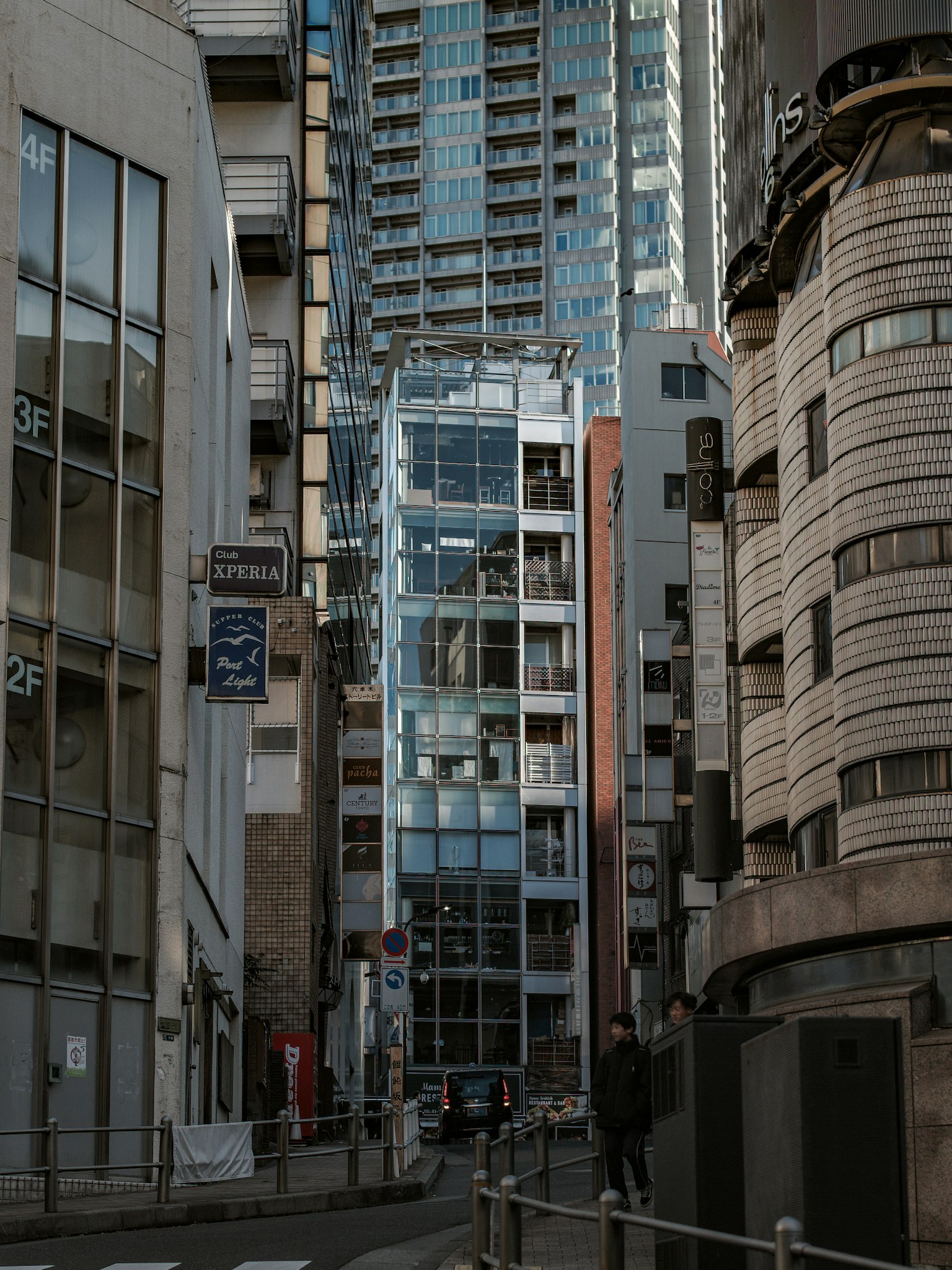 Urban scene with high-rise buildings featuring a glass elevator