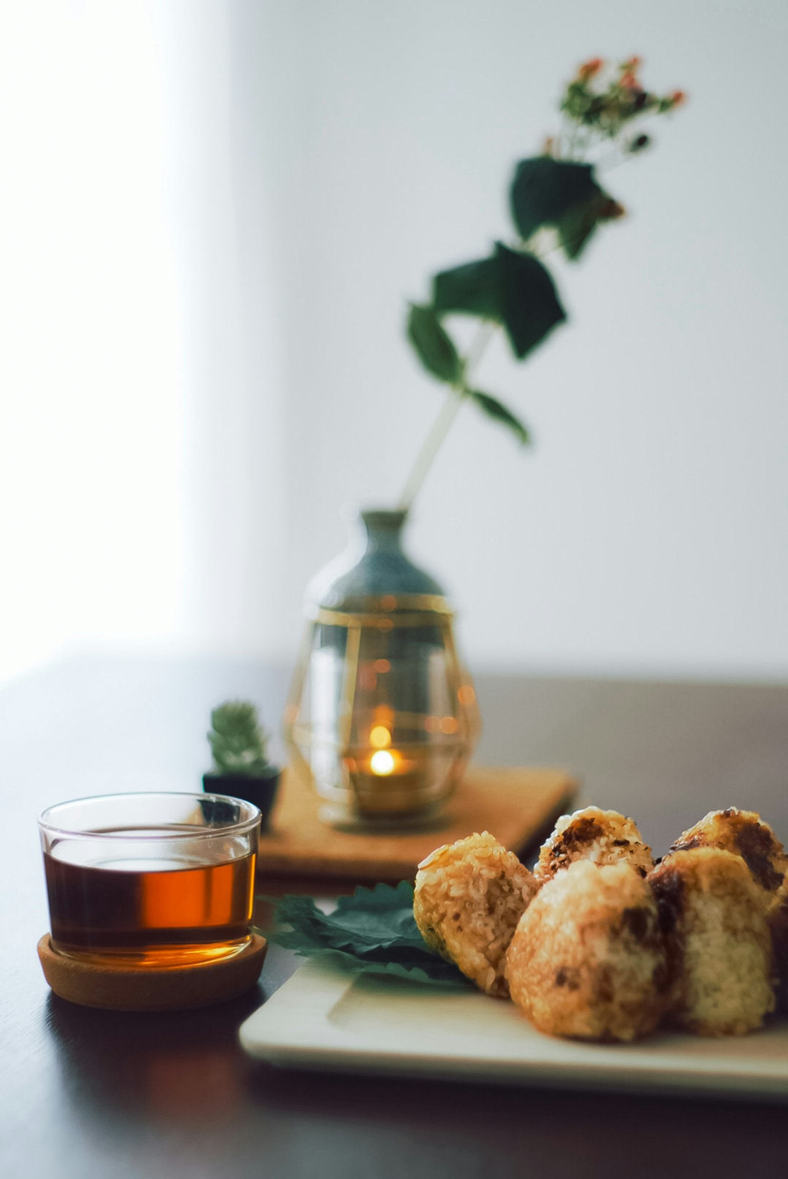 A beautiful arrangement of tea and baked goods on a table with natural lighting