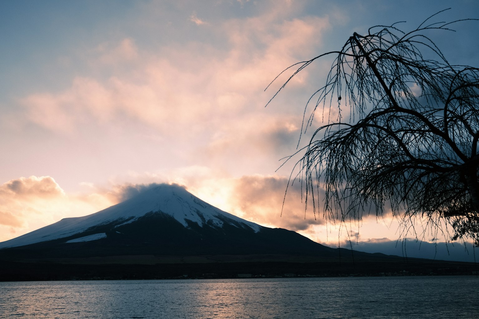 Mount Fuji at sunset with a tranquil lake