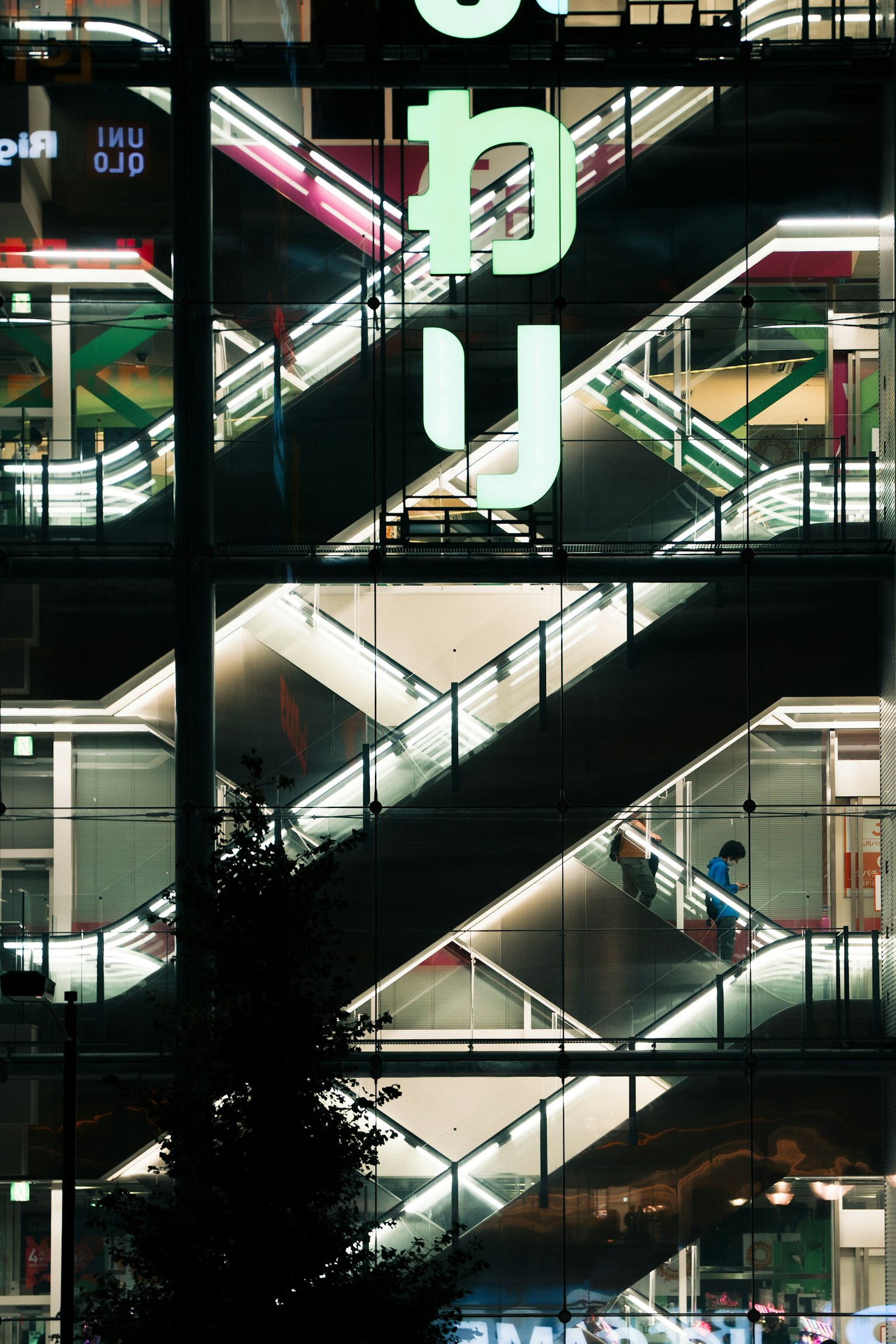 Modern building staircase with bright lighting in a night urban scene