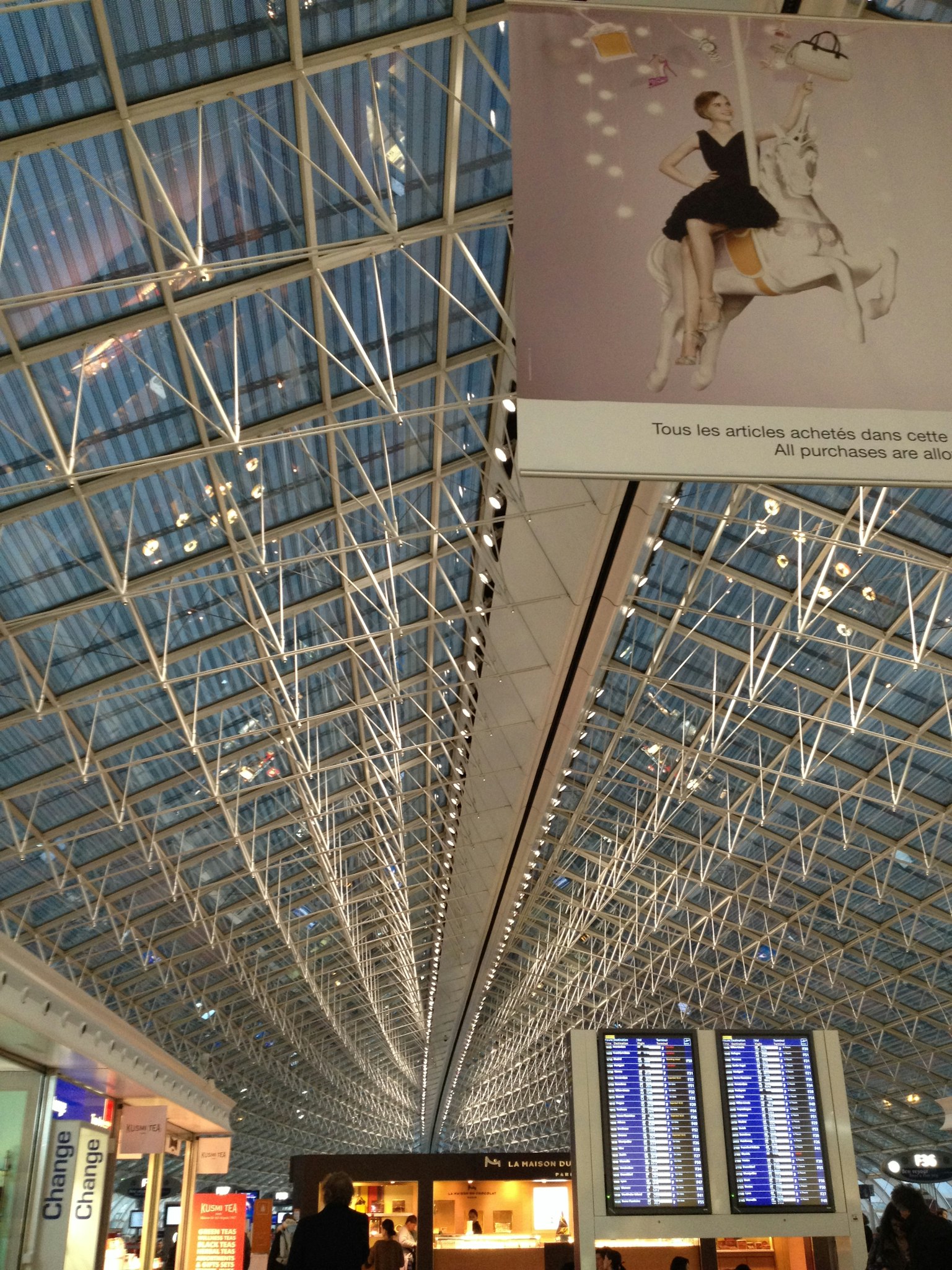 Interior view of a modern airport showcasing its high ceiling design